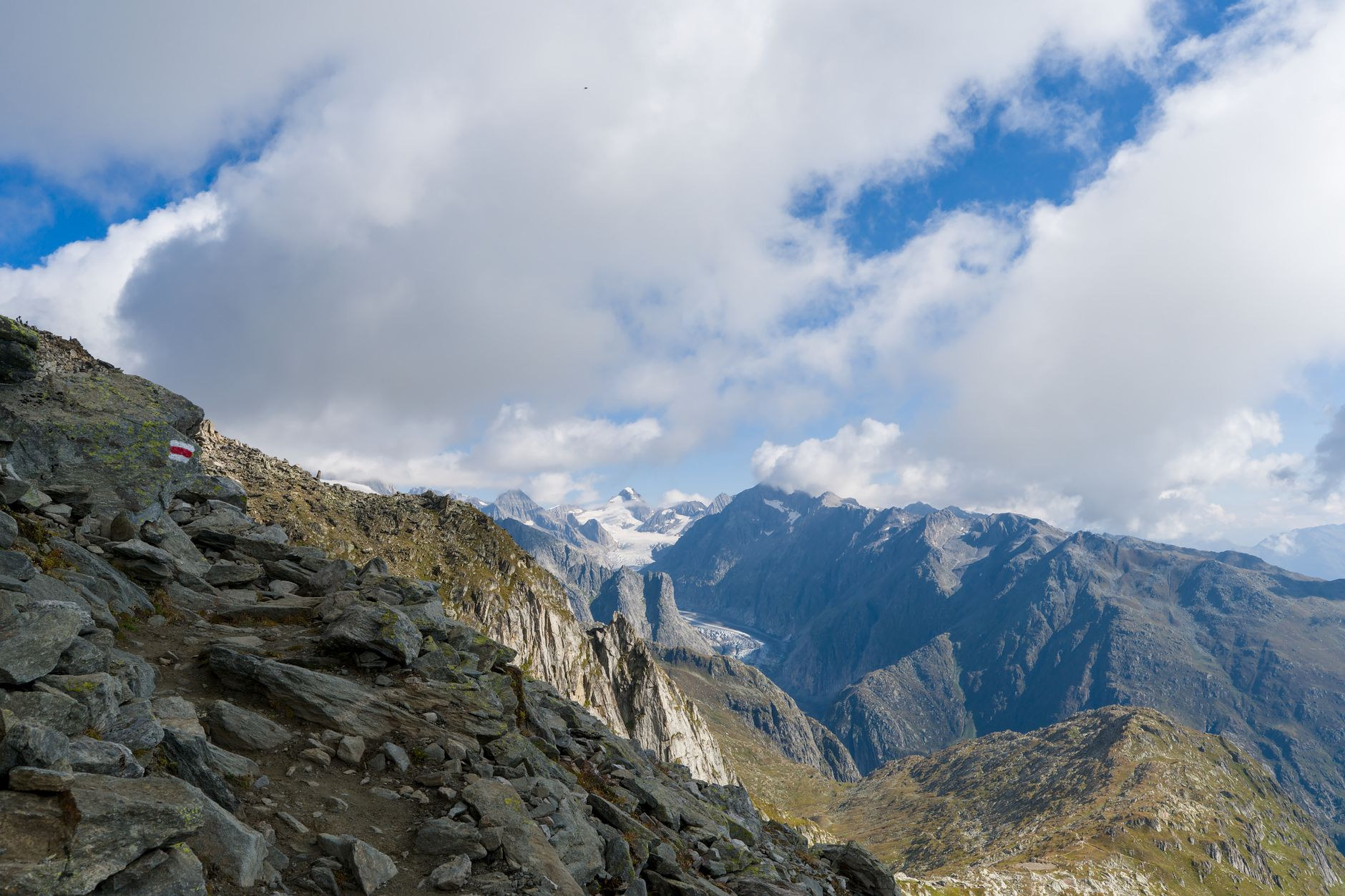 Challenging narrow alpine footpath carved into sheer limestone rock ridges high above the Rhine Valley