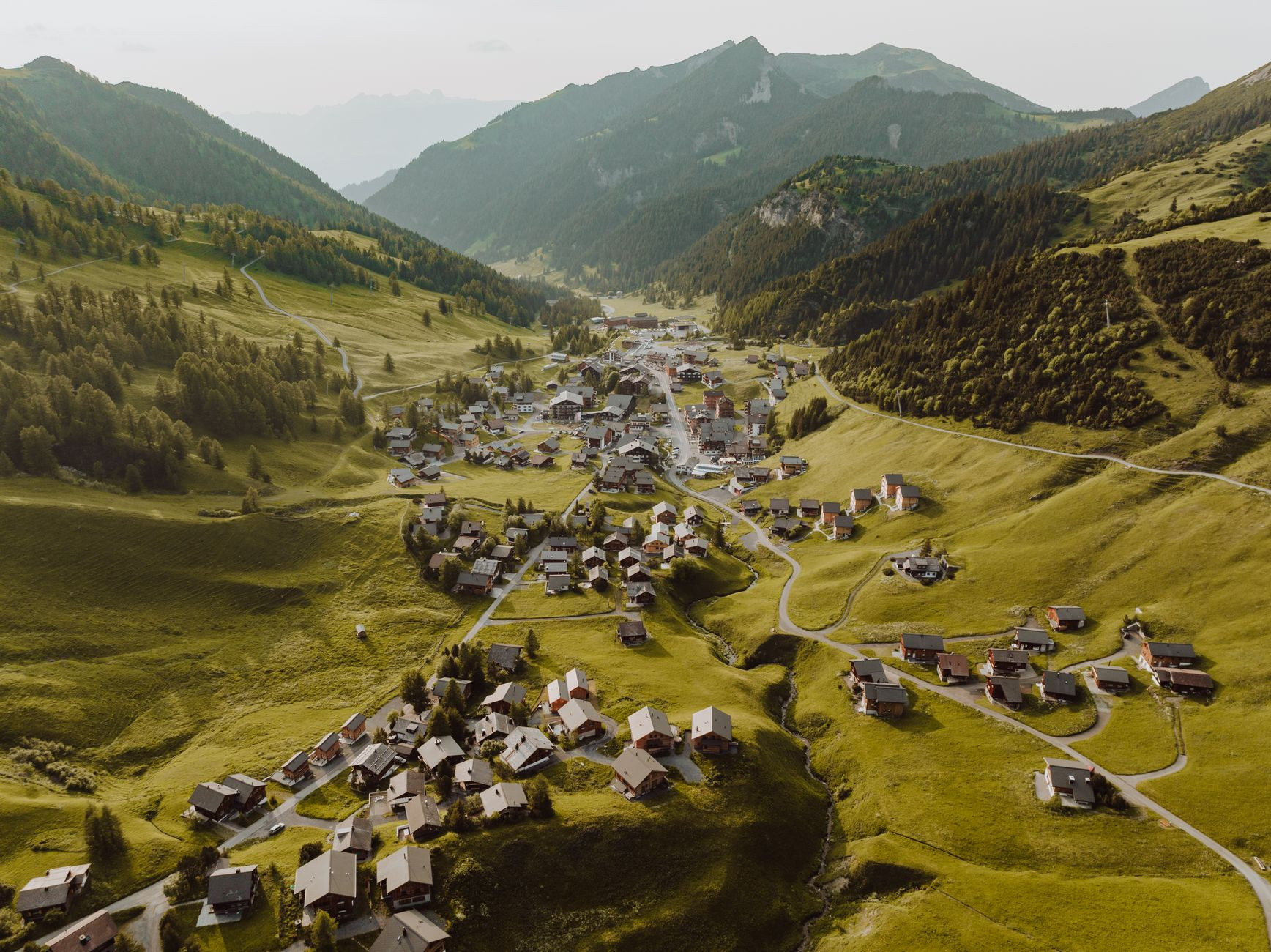 High alpine mountain village of Malbun surrounded by soaring rocky summits and green pastures at 1600 meters