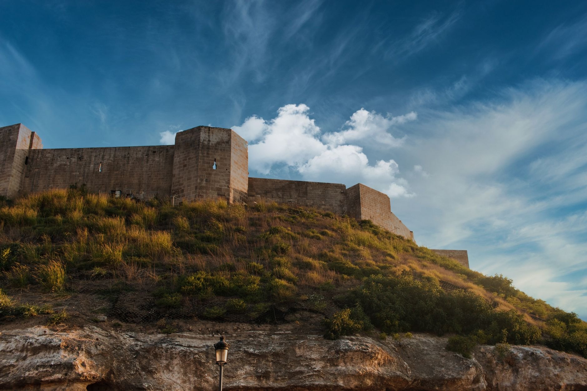 Ancient stone ramparts and defensive towers of Samuel's Fortress crowning the hill above the town of Ohrid