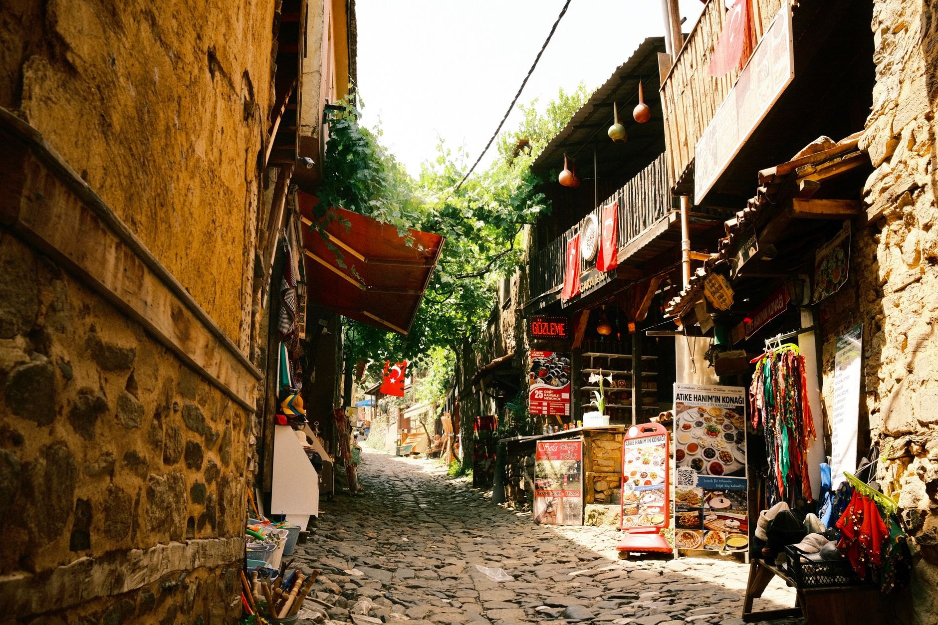 Narrow cobblestone street in Skopje Old Bazaar lined with traditional jewelers, artisan shops, and tea houses