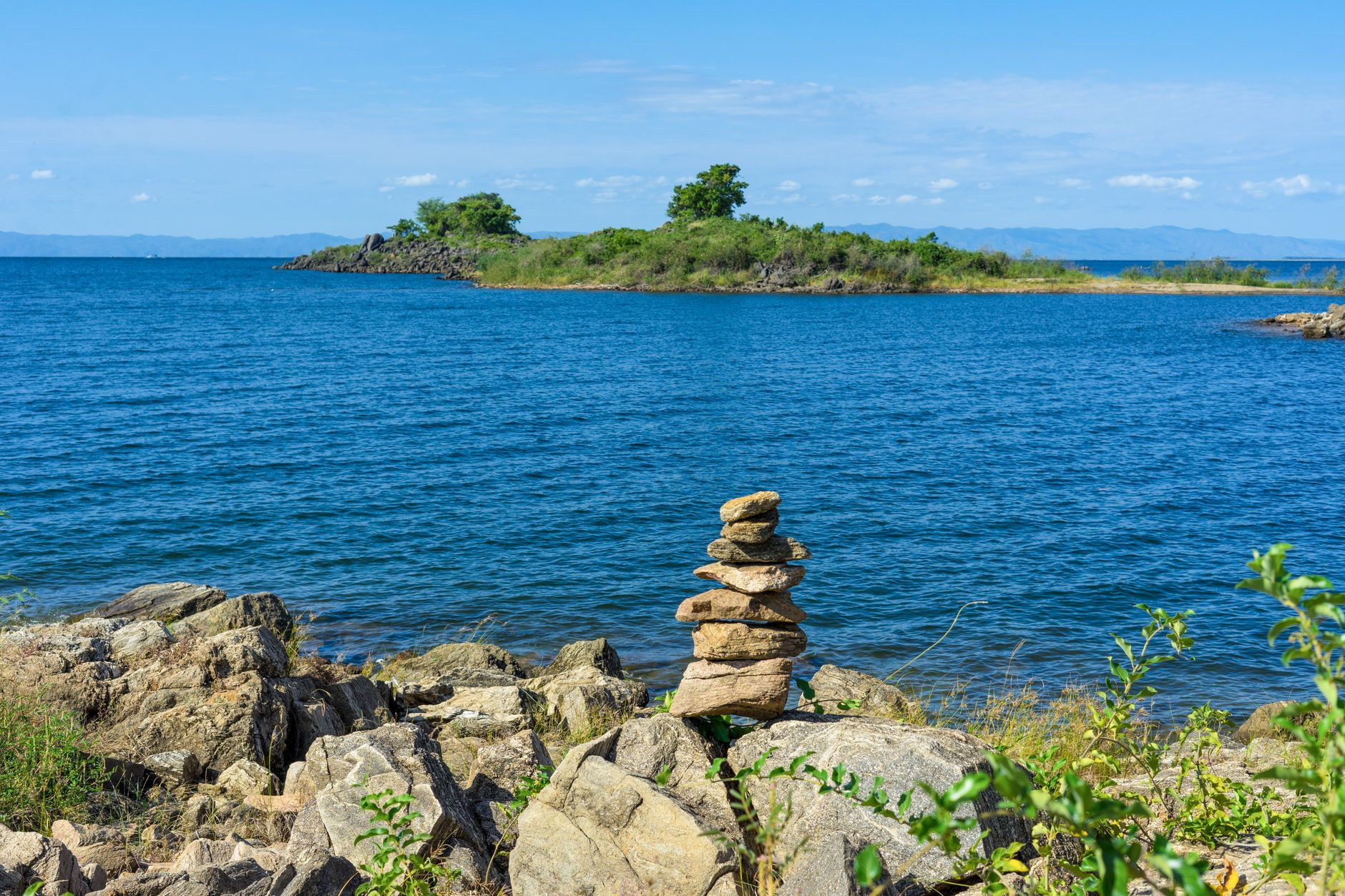 Granite boulders and crystal clear turquoise waters along the protected rocky shoreline of Lake Malawi National Park