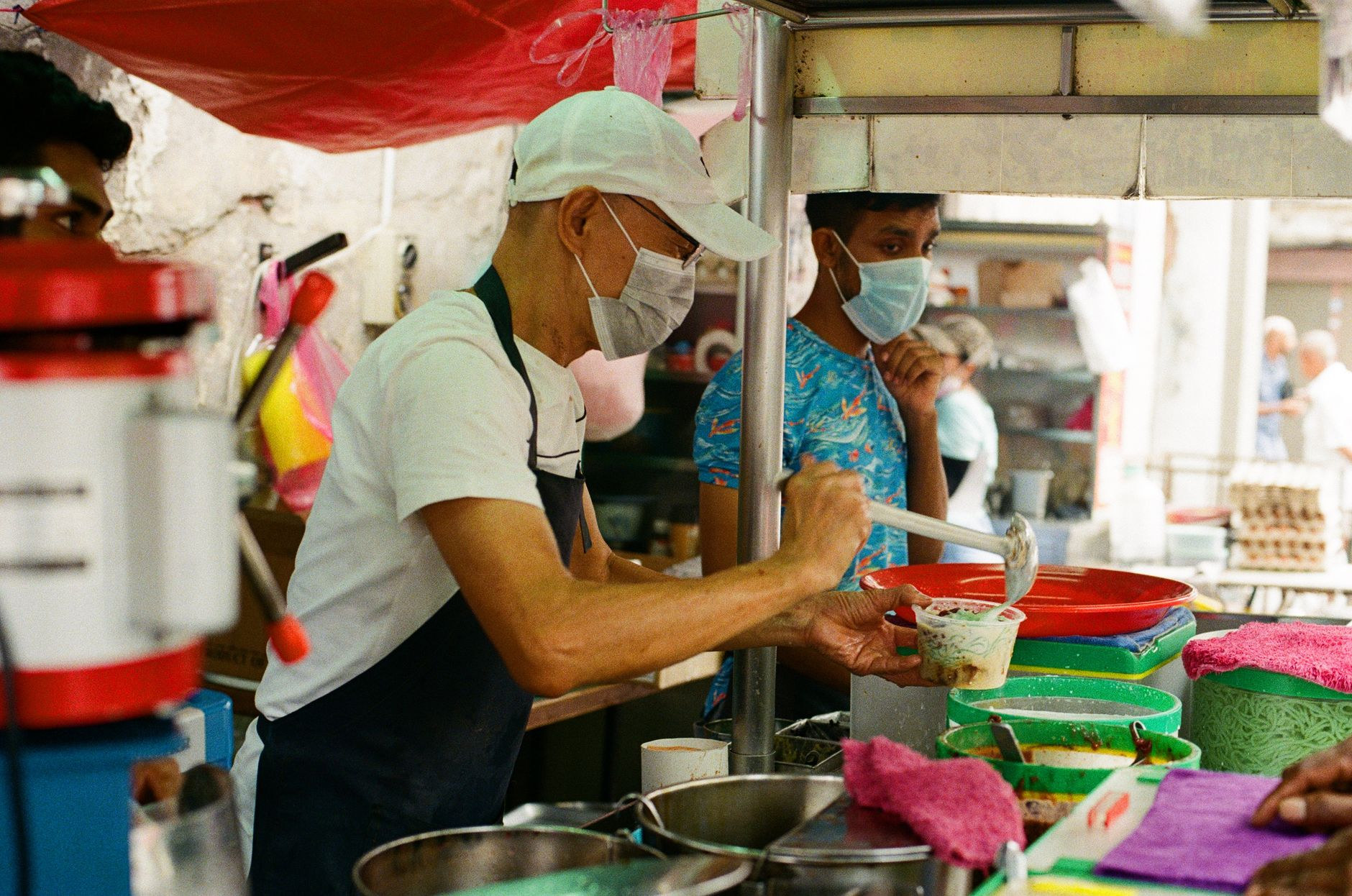 Sizzling street food wok cooking at an open-air hawker market