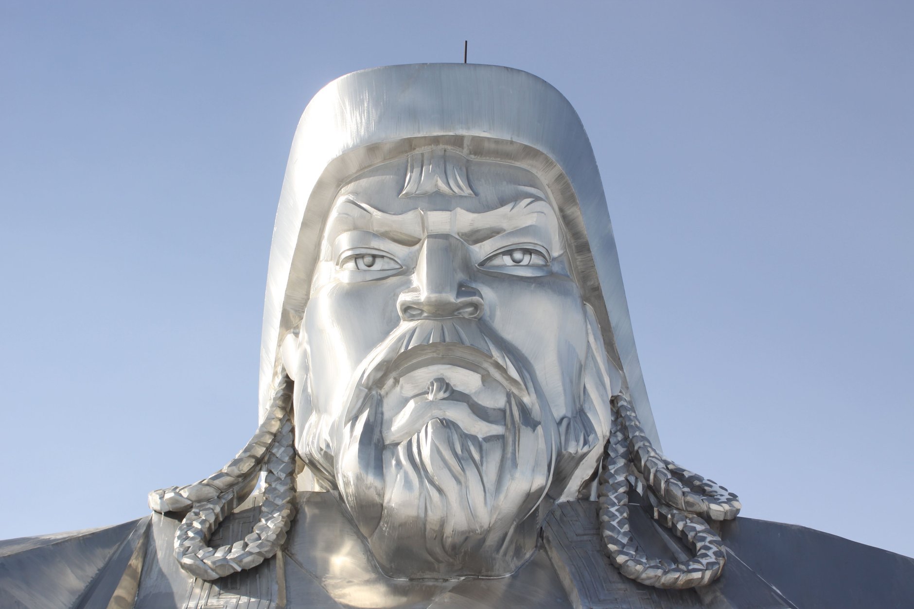 Colossal forty-meter stainless steel equestrian statue of Genghis Khan rising above the rolling hills at Tsonjin Boldog