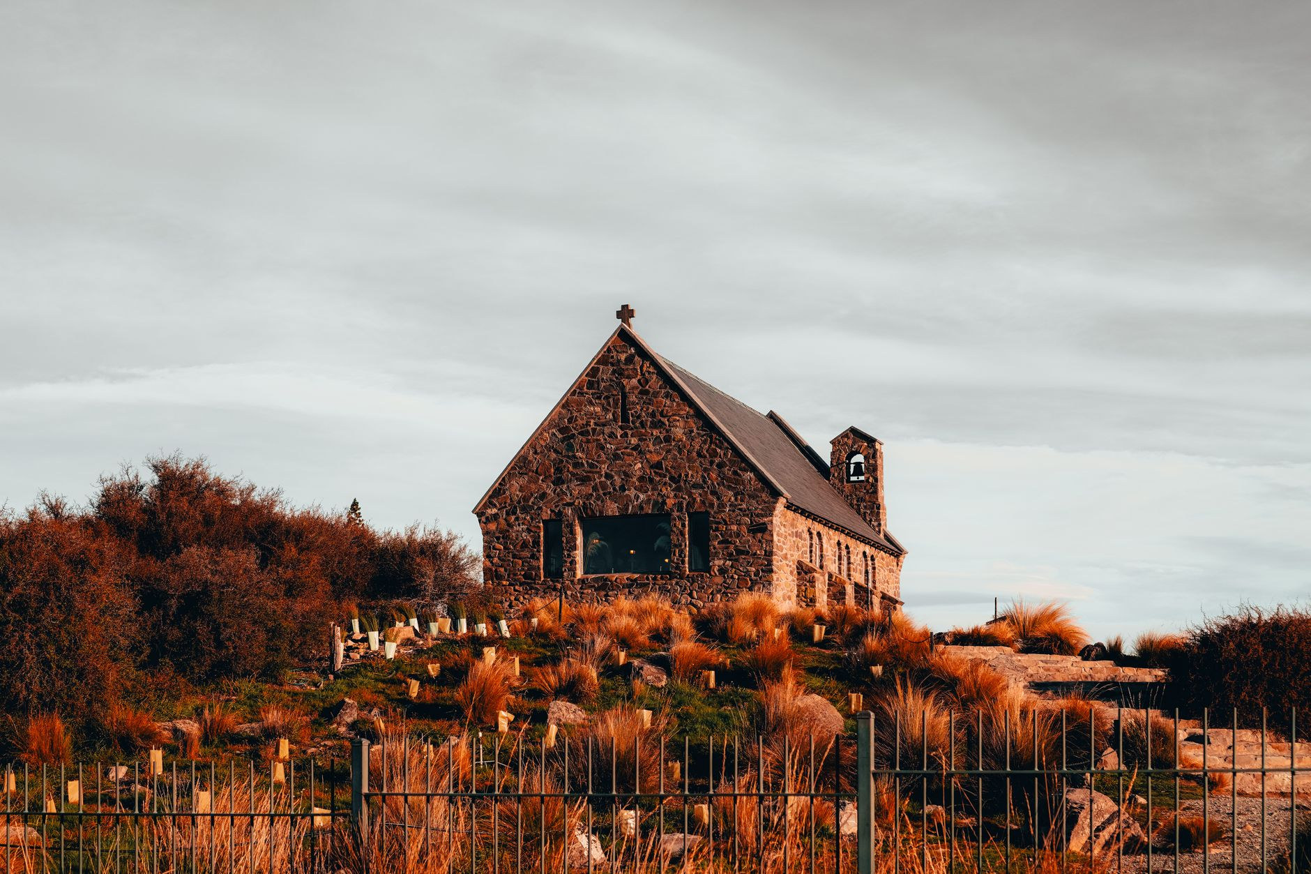 Historic stone church on the turquoise shores of Lake Tekapo