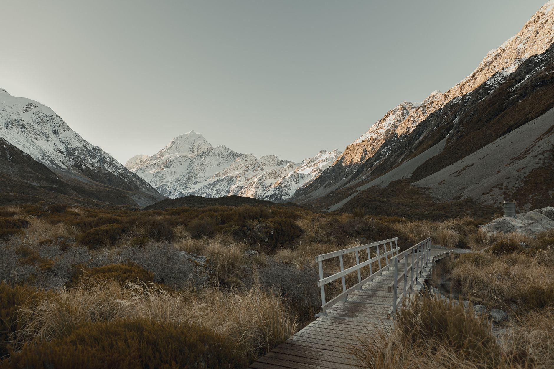 Suspension bridge and alpine peaks in Hooker Valley, Aoraki
