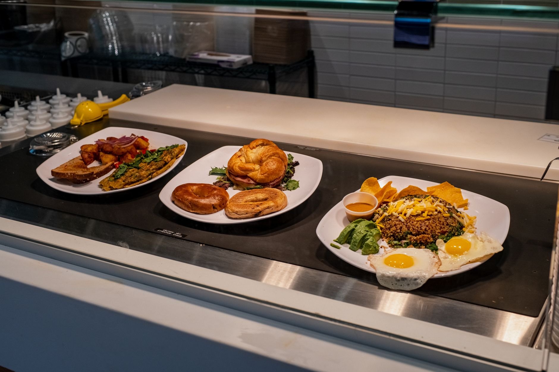 Hearty Nicaraguan breakfast platter with dark seasoned gallo pinto, sweet fried maduros, fresh salty cuajada cheese, and eggs