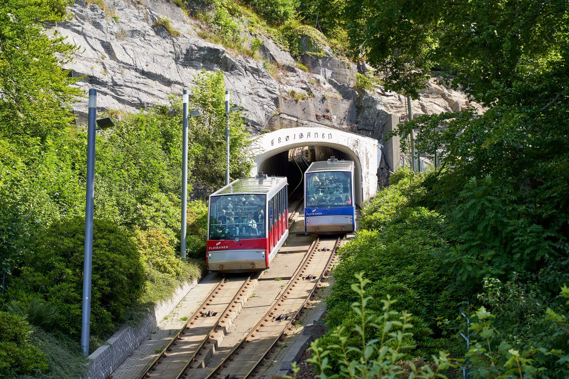 Passenger train crossing the rugged sub-arctic mountain plateau of Hardangervidda in Norway