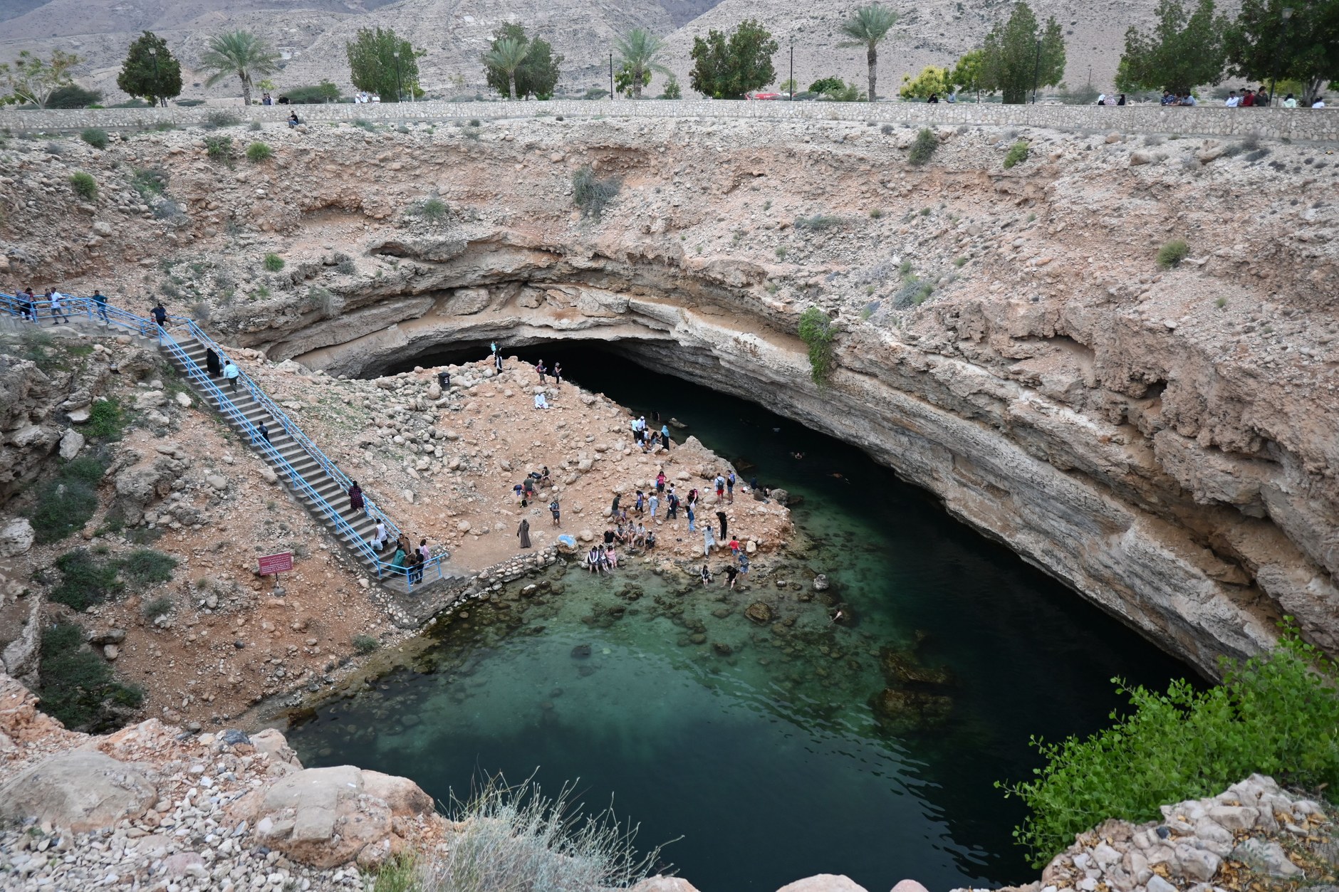 Turquoise limestone sinkhole pool of Bimmah Sinkhole Hawiyat Najm