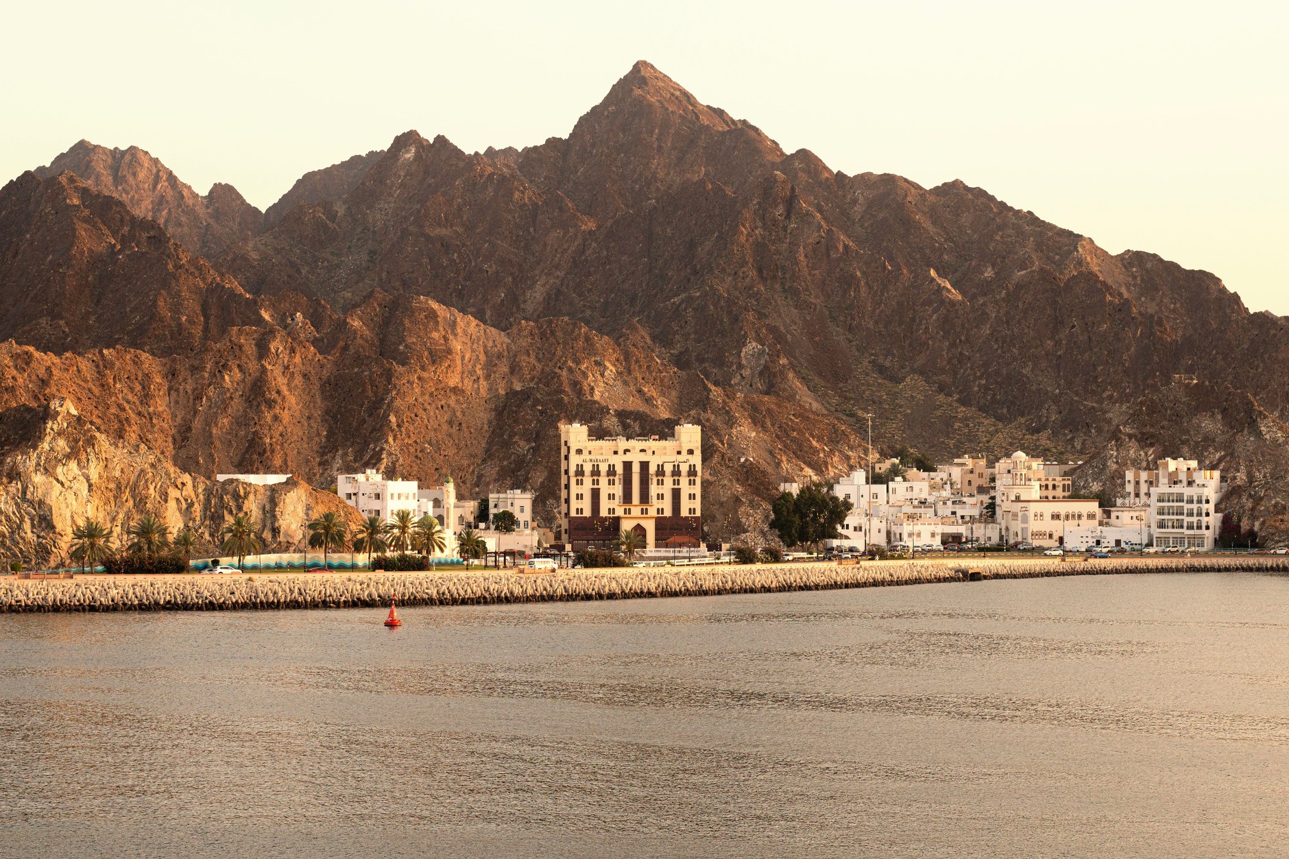 The curved harbor promenade and mountain backdrop of Mutrah Corniche in Muscat