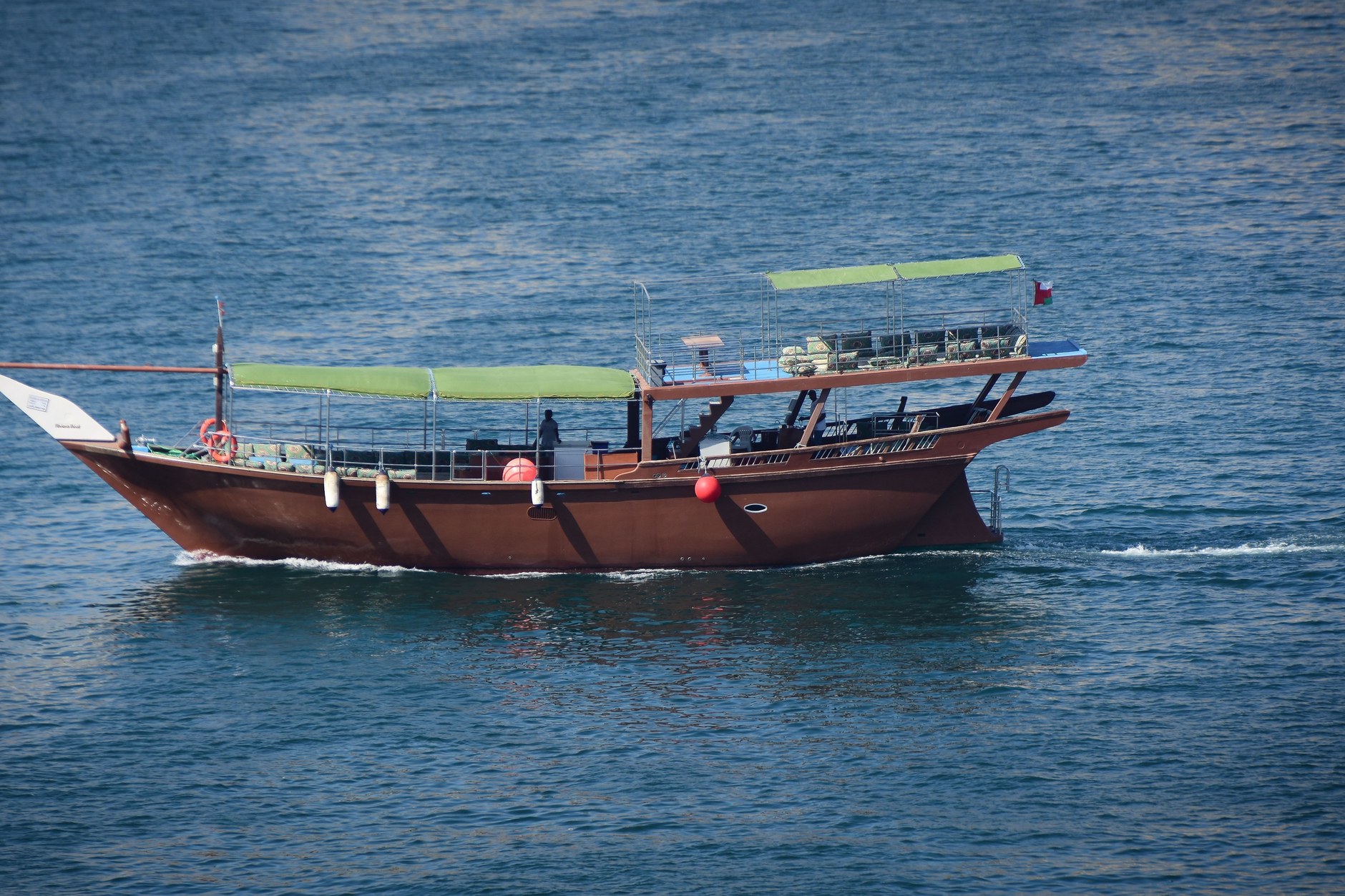 Handcrafted traditional wooden dhow boats under construction in the maritime shipyards of Sur