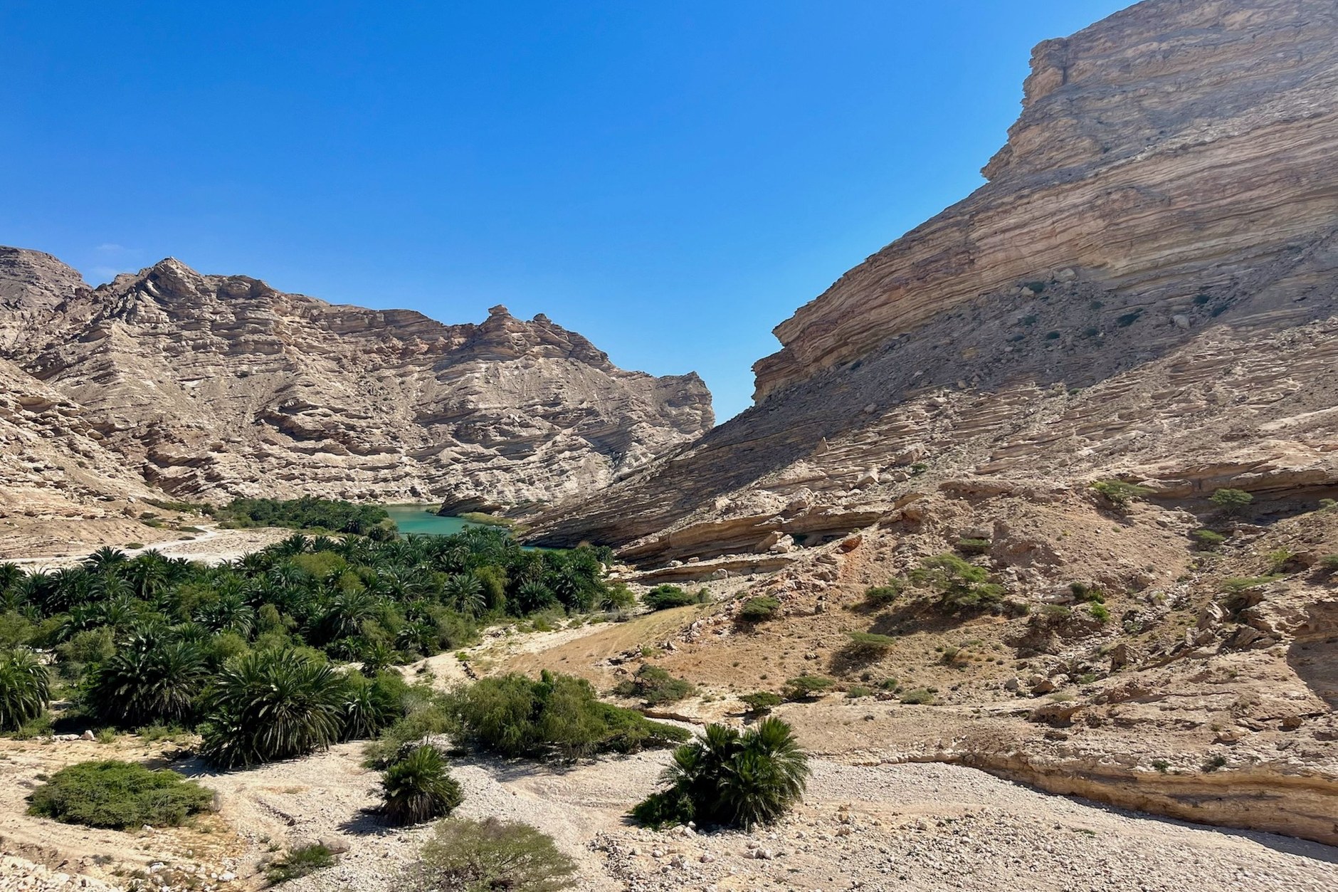 Limestone canyon gorge and turquoise freshwater swimming pools of Wadi Shab