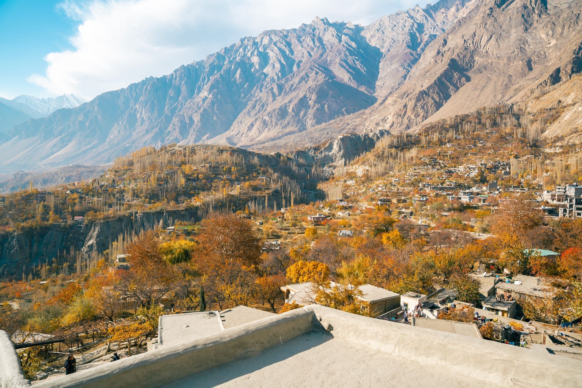 800-year-old timber and stone Baltit Fort perched on a high rocky bluff overlooking the terraced apricot orchards of Karimabad in Hunza