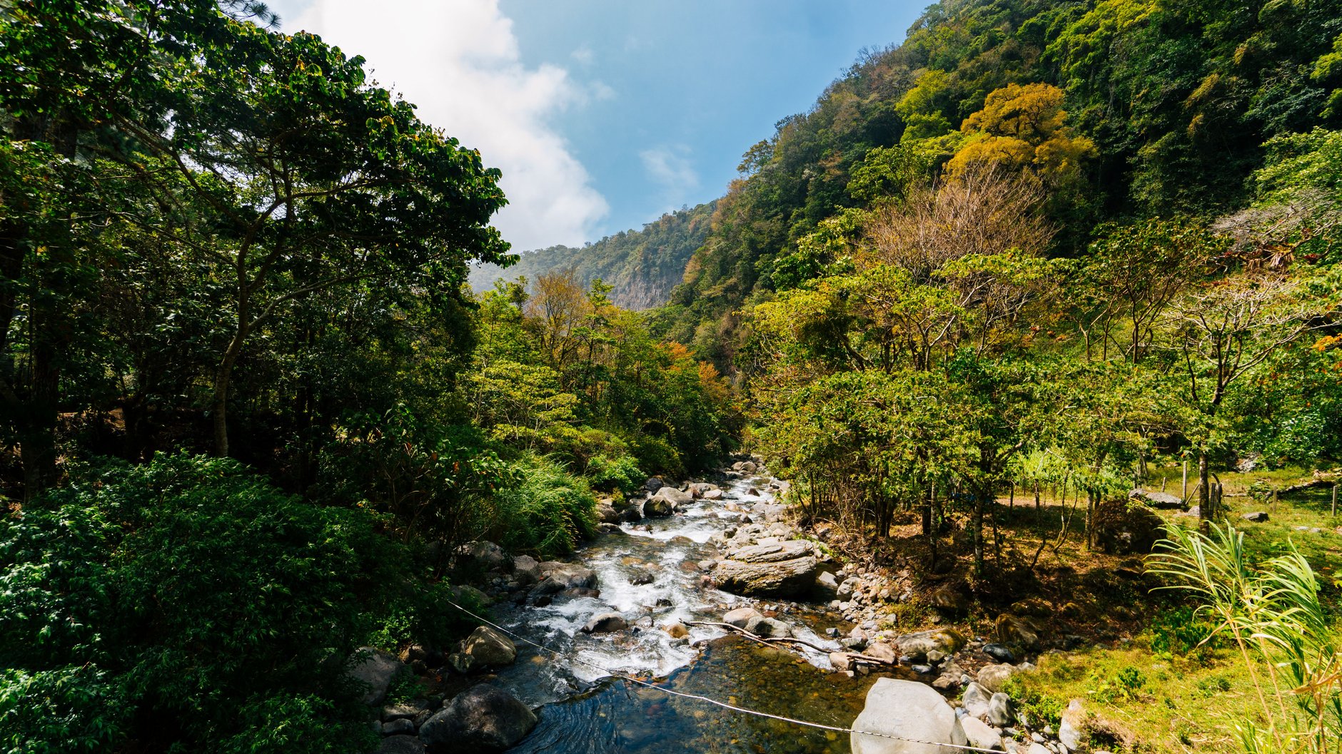 Misty emerald green mountain valley and forested slopes surrounding the highland town of Boquete in Chiriqui province