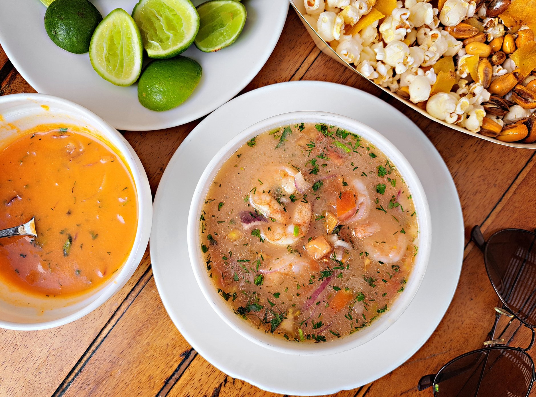 Freshly prepared corvina fish ceviche marinated in lime juice with onions and cilantro served in a traditional cup