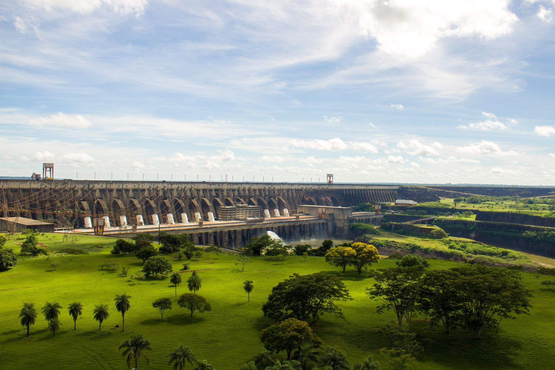 Monumental concrete spillway and massive hydroelectric dam structure of Itaipu spanning across the Paraná River