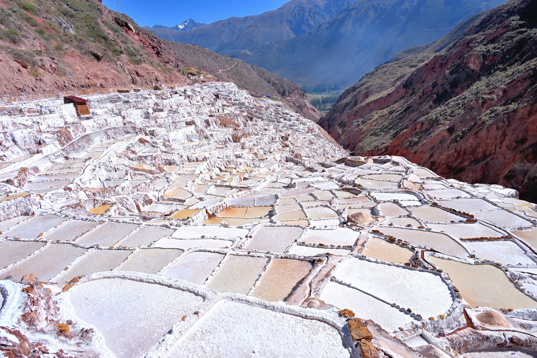 Geometric terraced evaporation pools of the Maras salt pans Salineras in the Sacred Valley