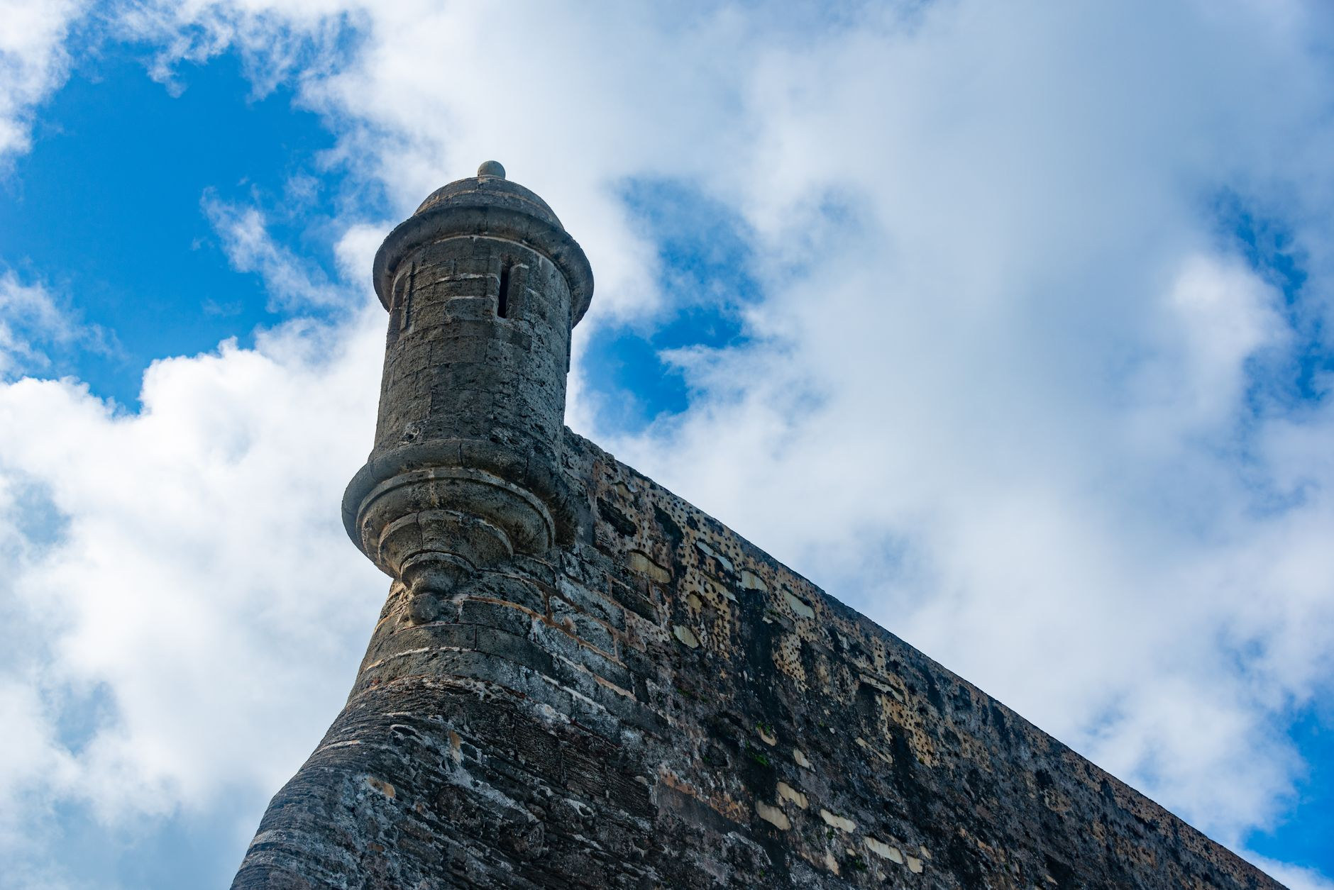 An iconic stone sentry box perched along the historic defensive walls of Castillo San Felipe del Morro