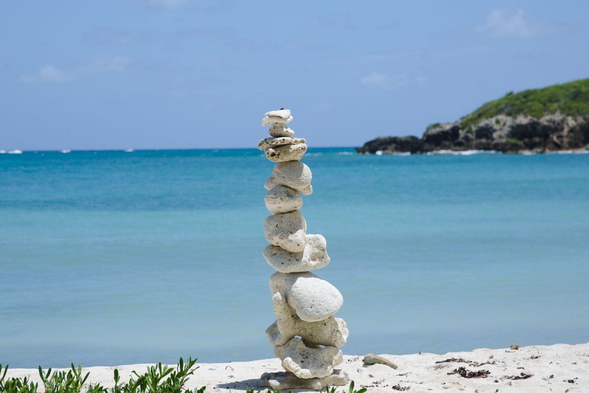 A tranquil sandy shoreline and crystal-clear turquoise waters on the wild southern coast of Vieques