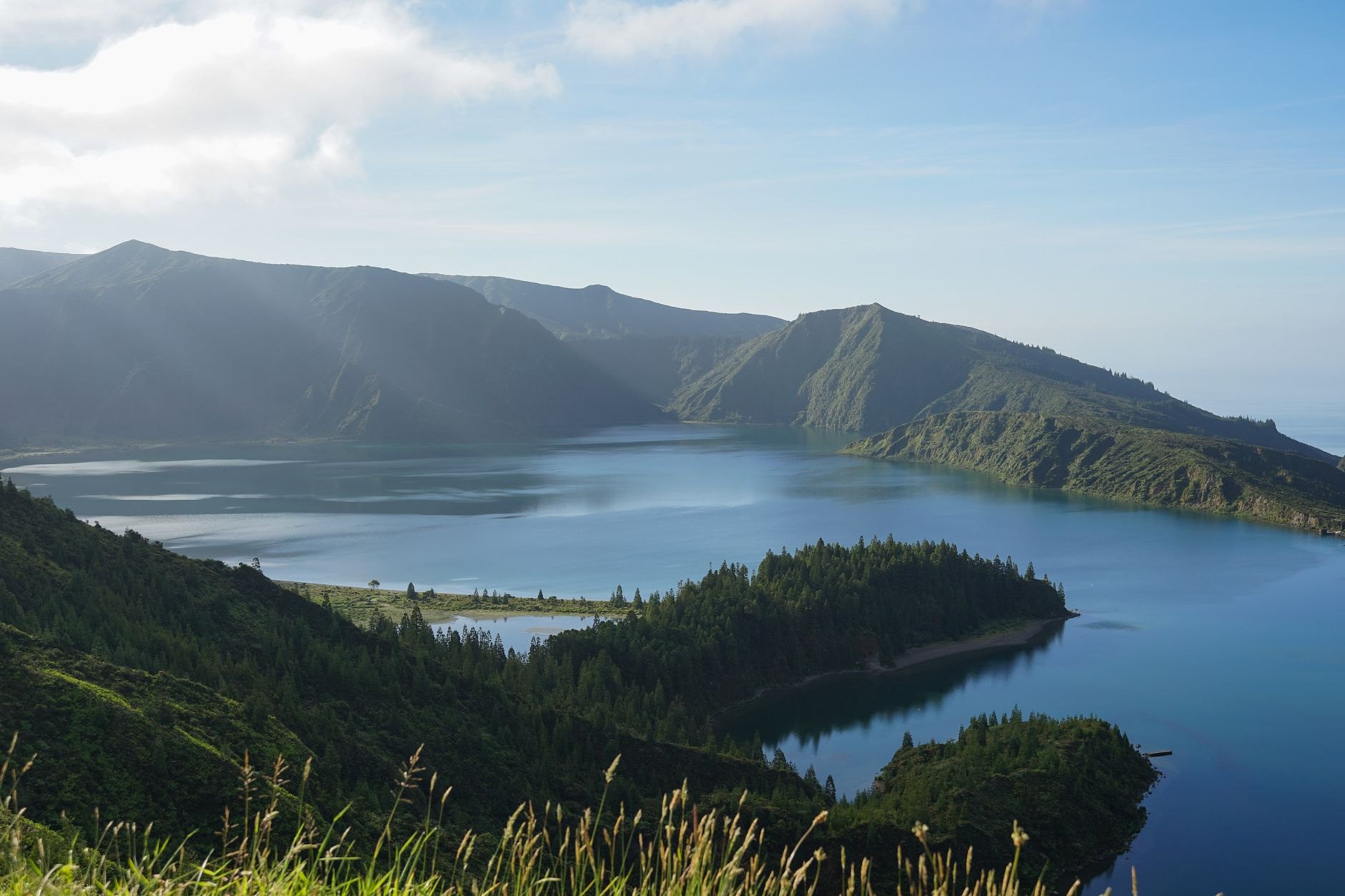 Spectacular elevated panorama over sapphire-blue Lake Burera and Lake Ruhondo cradled by steep agricultural hillsides