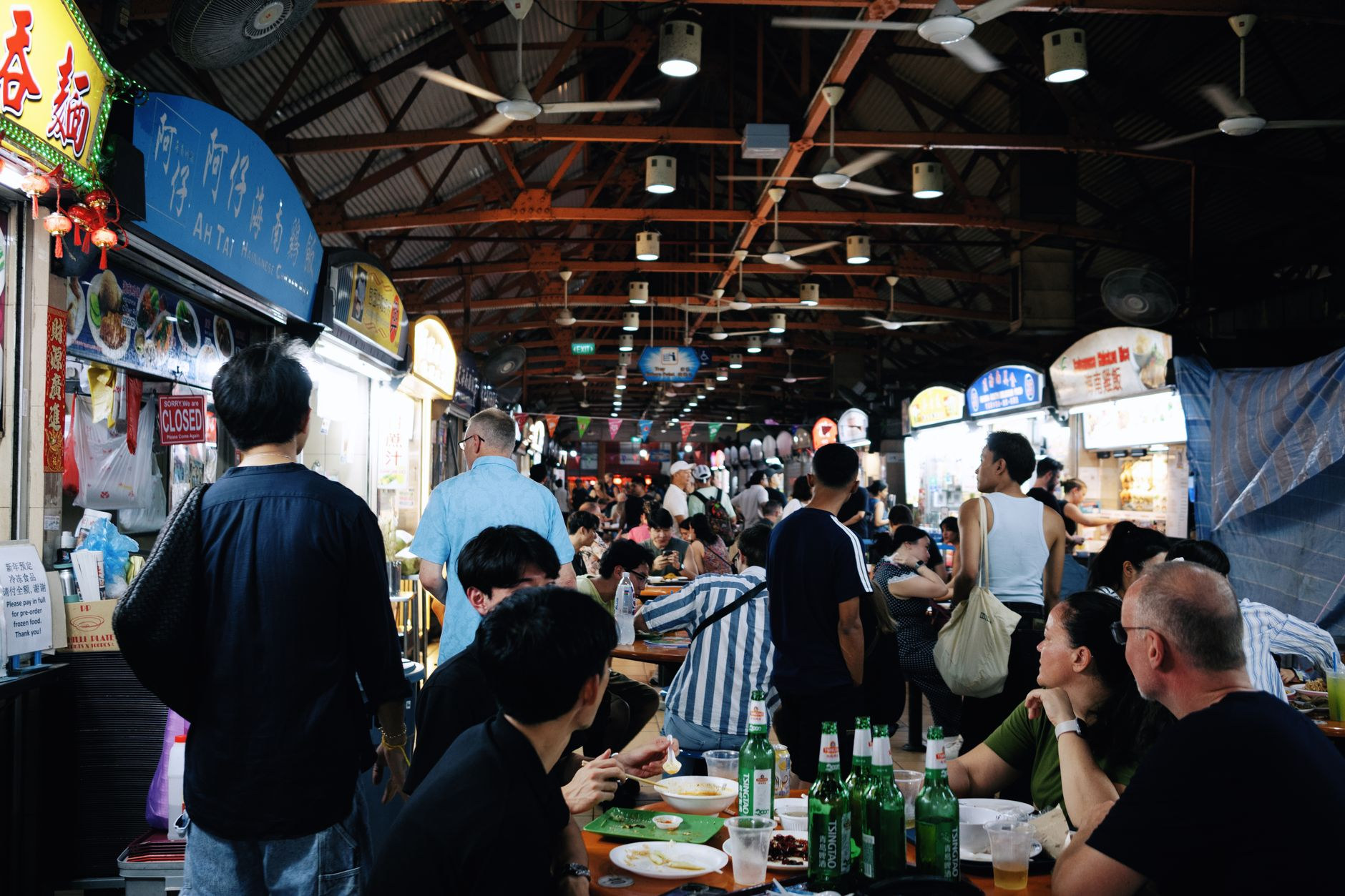 Buzzing atmosphere of a traditional Singapore hawker centre
