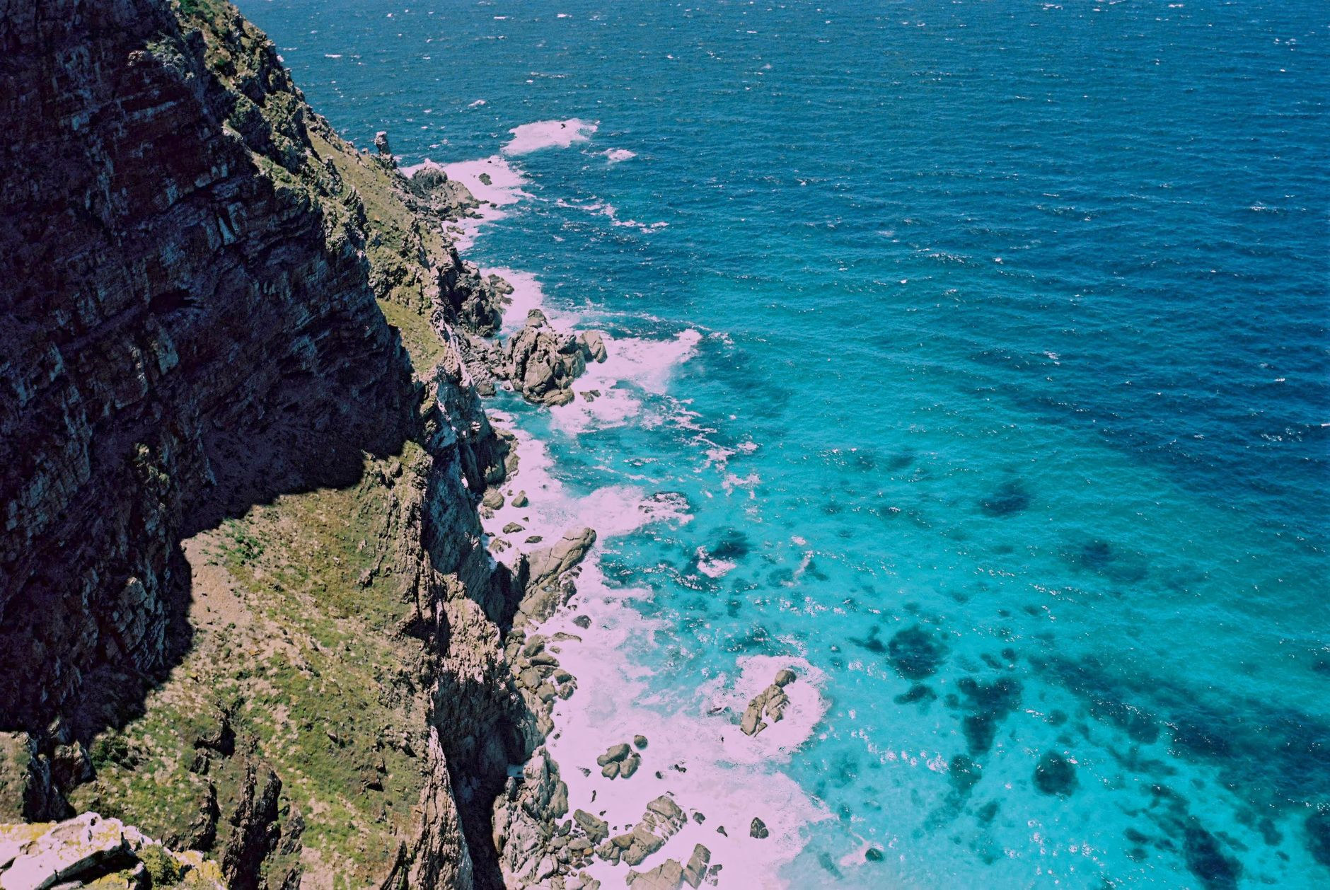 Dramatic sheer cliffs and crashing waves at Cape Point