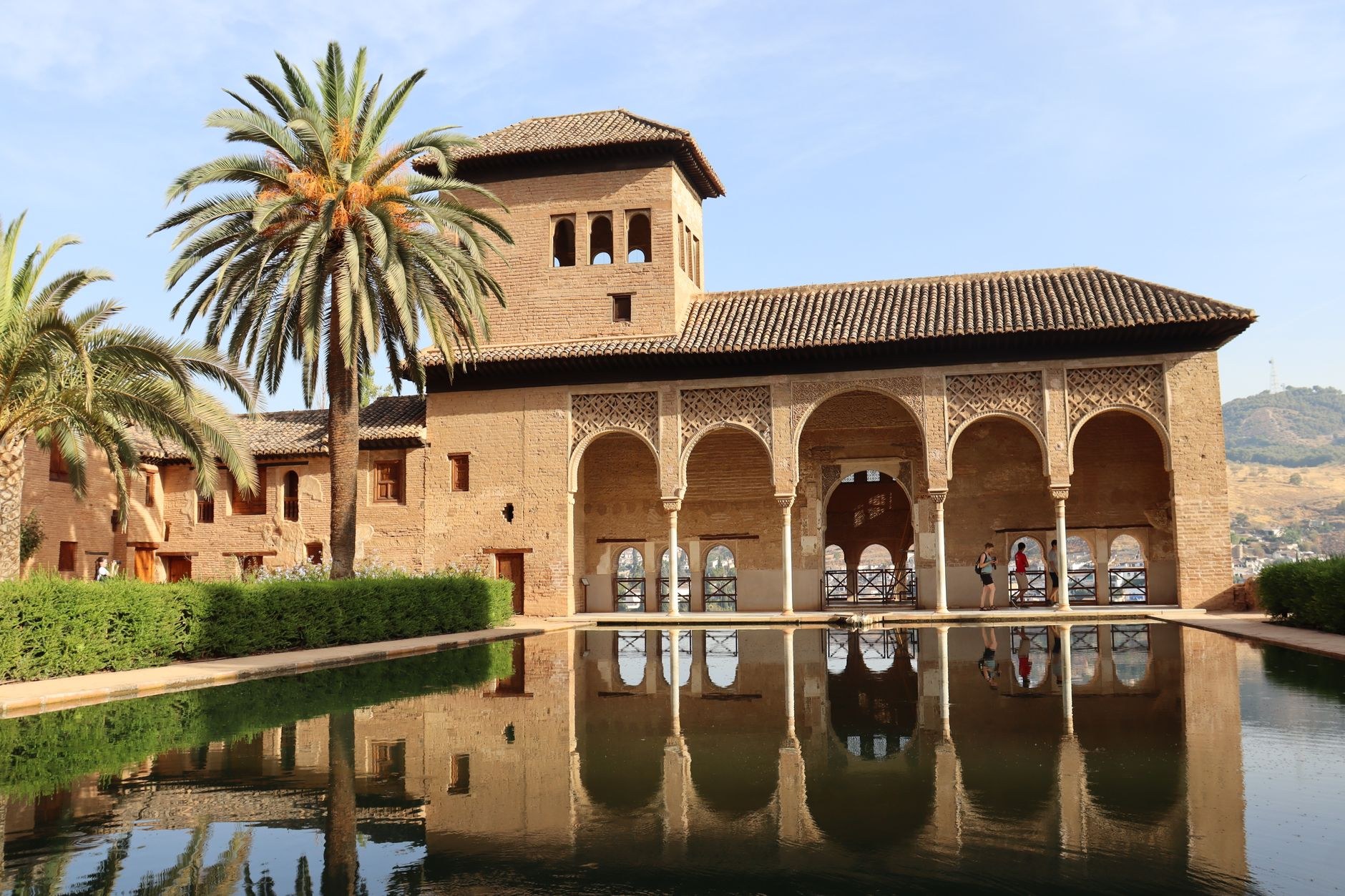 Moorish palace arcades and reflecting pool of the Alhambra in Granada