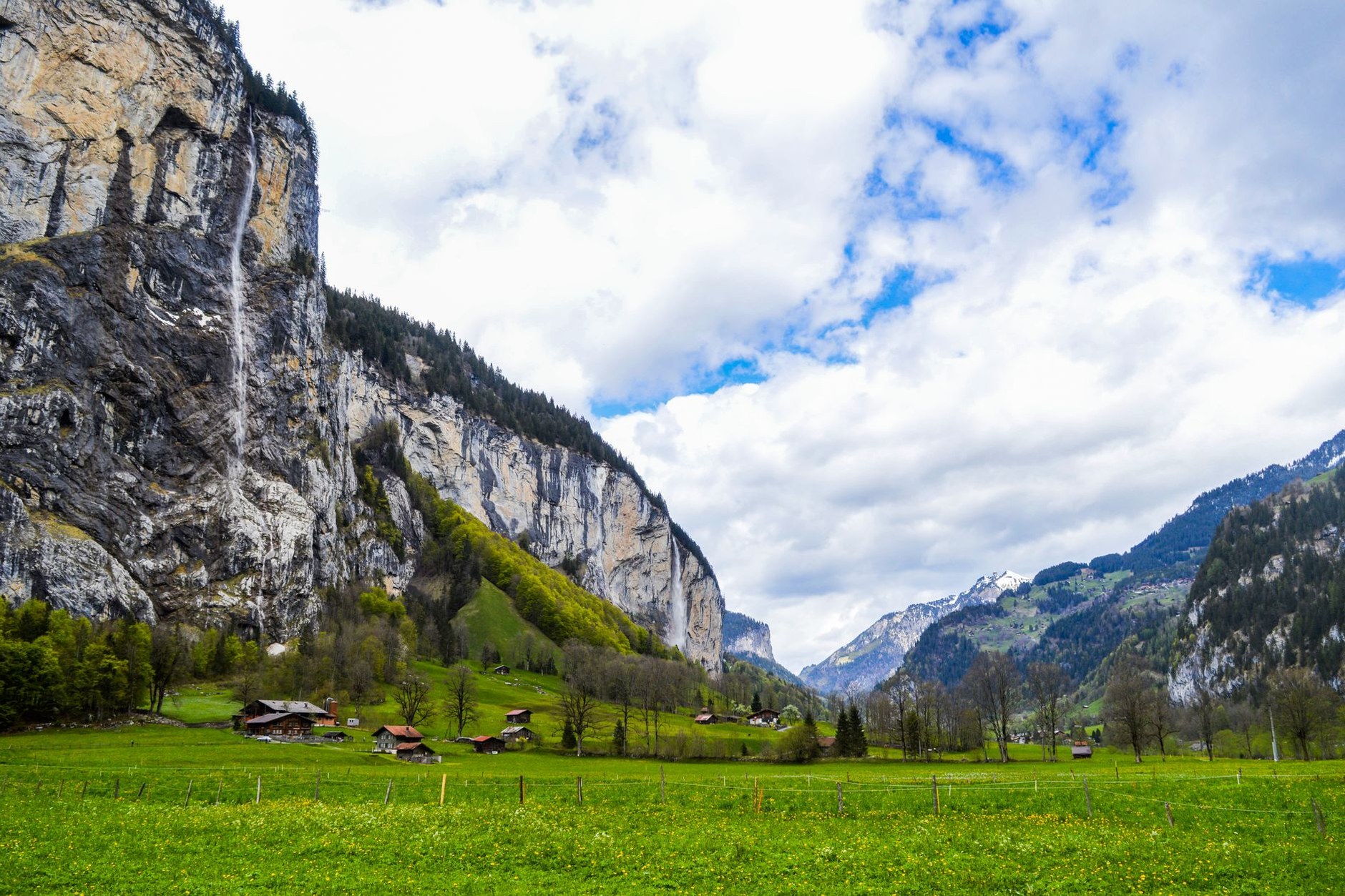 The U-shaped glacial canyon of Lauterbrunnen with Staubbach Falls tumbling down limestone cliffs
