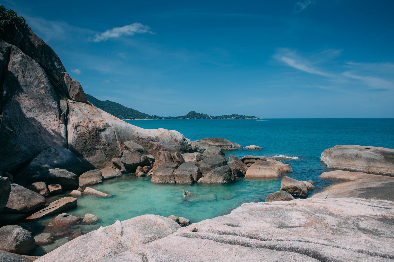 Granite rocks beside turquoise water on Koh Samui