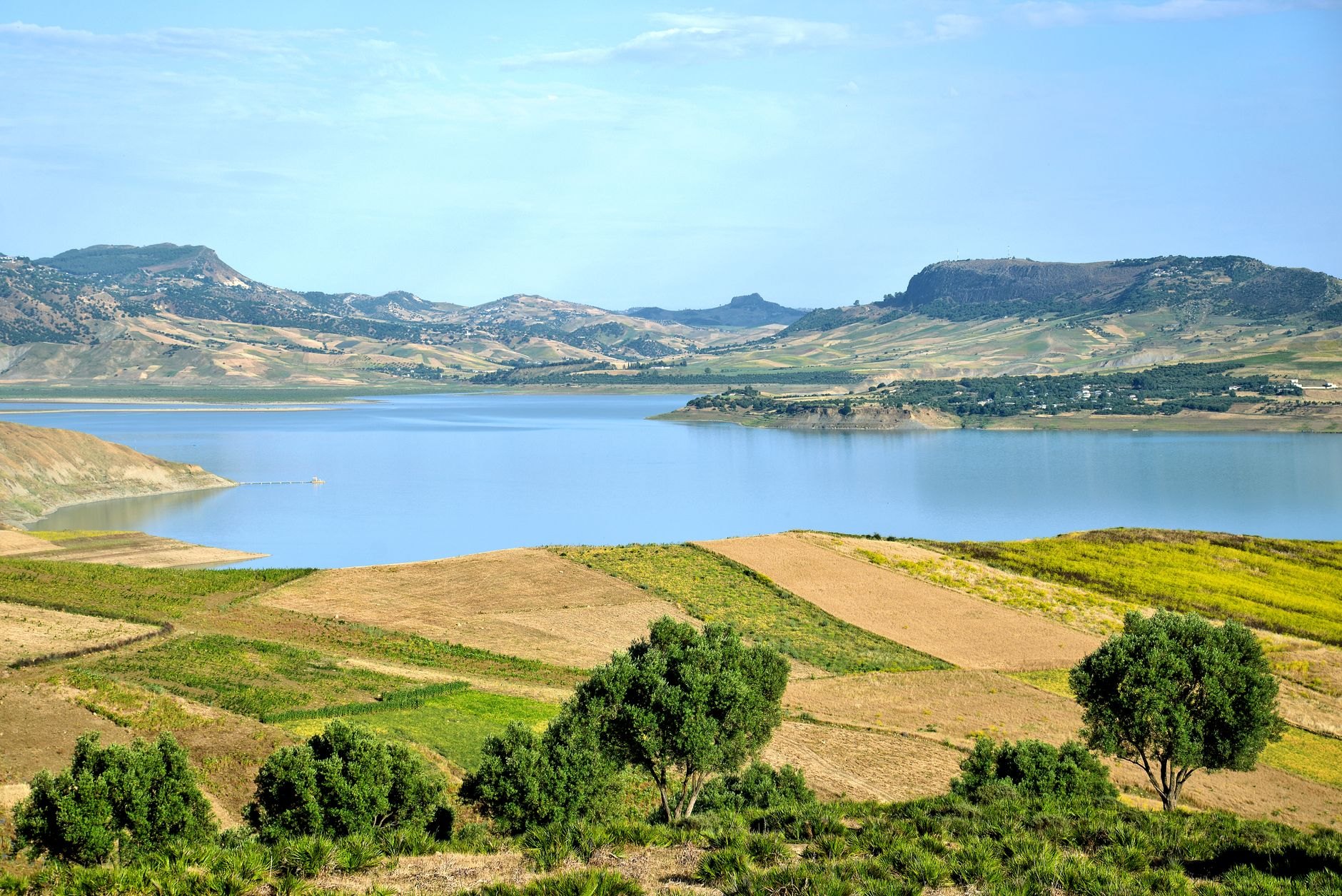 Stunning panorama over the serpentine blue waters and green terraced islands of Lake Bunyonyi in southwestern Uganda