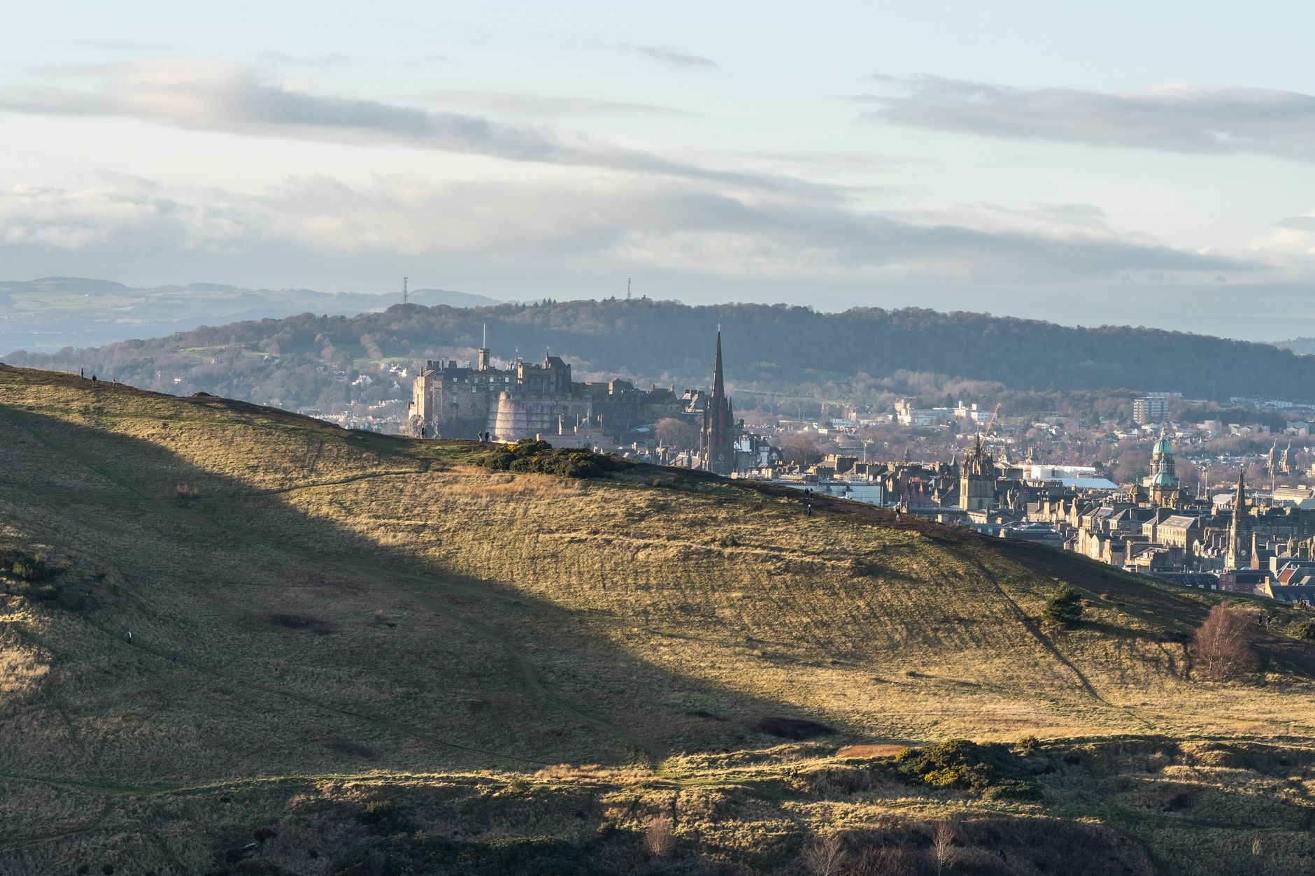 Historic fortress walls of Edinburgh Castle perched atop volcanic Castle Rock