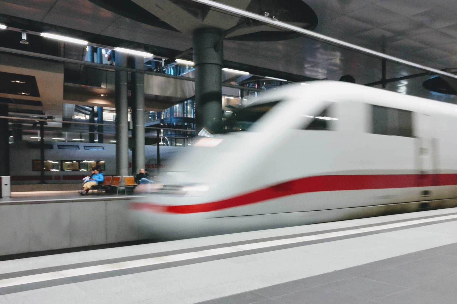 Sleek aerodynamic high-speed passenger train at a spotless railway terminal connecting Silk Road oasis cities