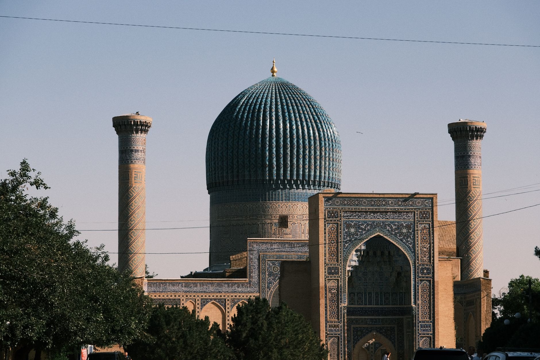 Fluted azure melon dome and intricate golden interior of Gur-e-Amir, the royal tomb of conqueror Tamerlane in Samarkand