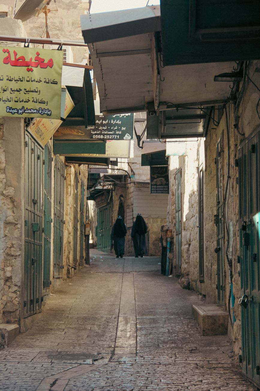 Traditional limestone buildings and paved pedestrian lane along Star Street in historic Bethlehem
