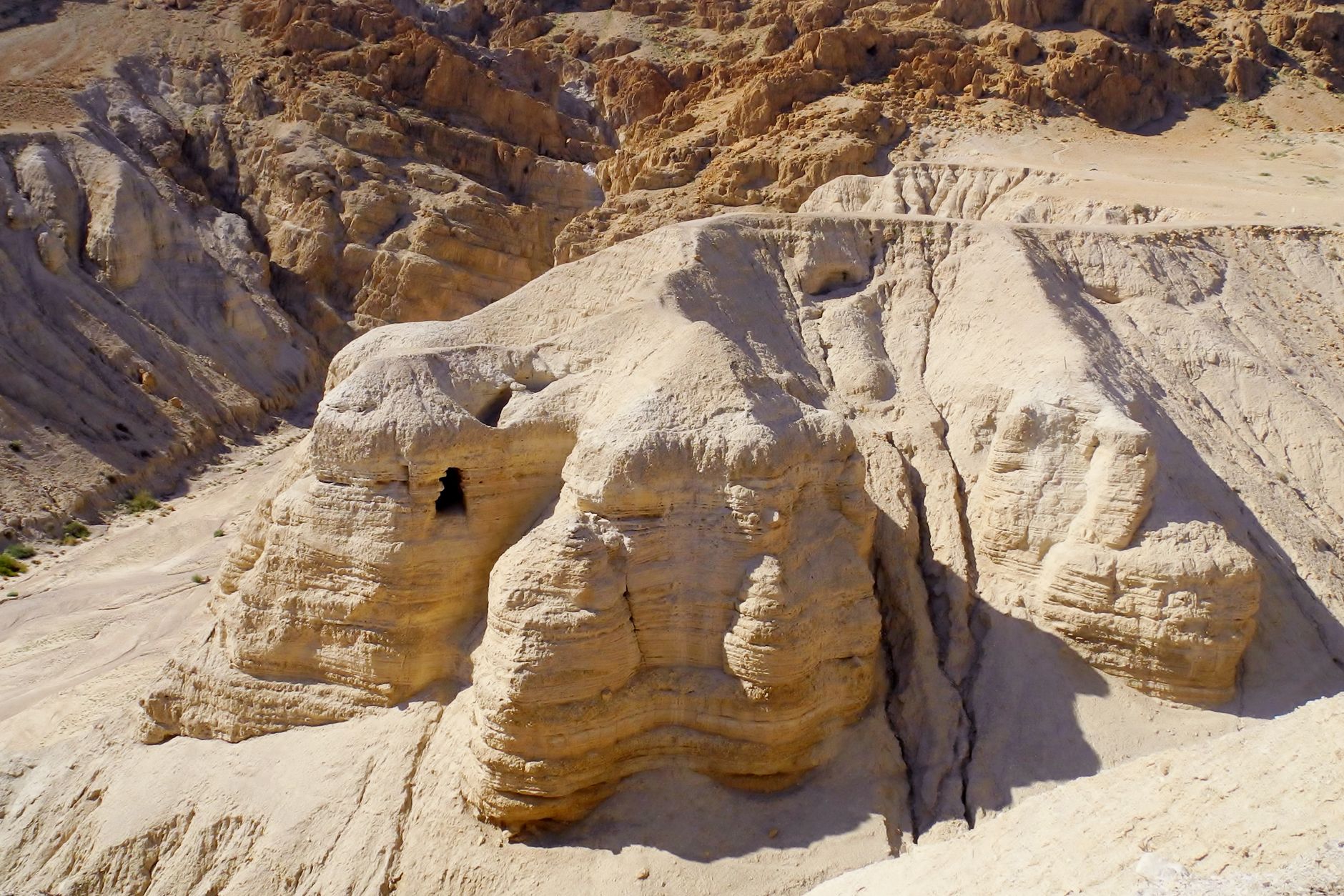 Rugged desert canyons and arid limestone ridges descending toward the Jordan Valley