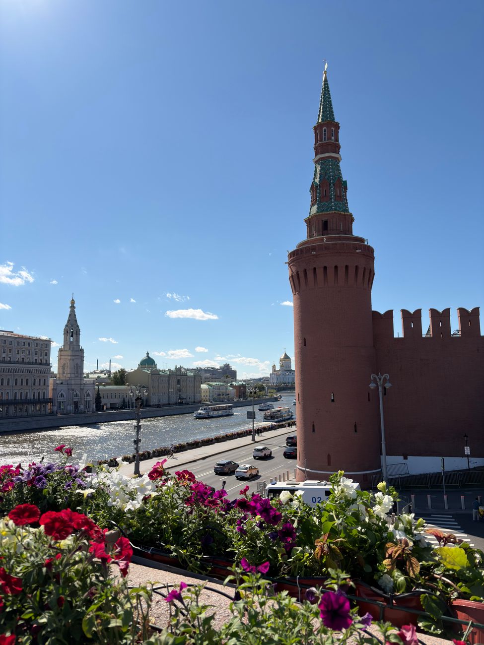 Historic red-brick walls and fortified towers of the Moscow Kremlin overlooking the Moskva River
