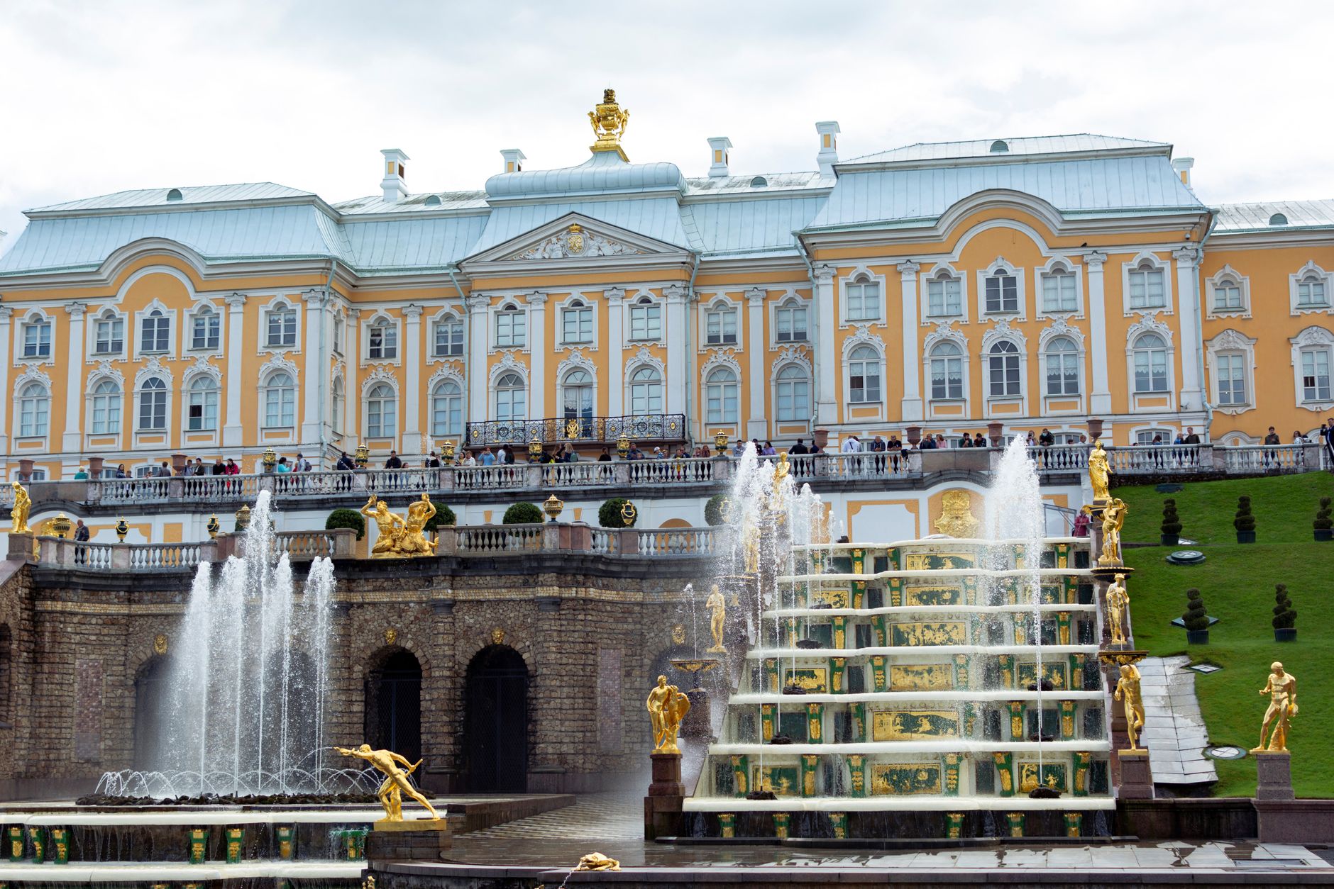 Gilded bronze statues and cascading water fountains of the Grand Cascade at Peterhof Palace