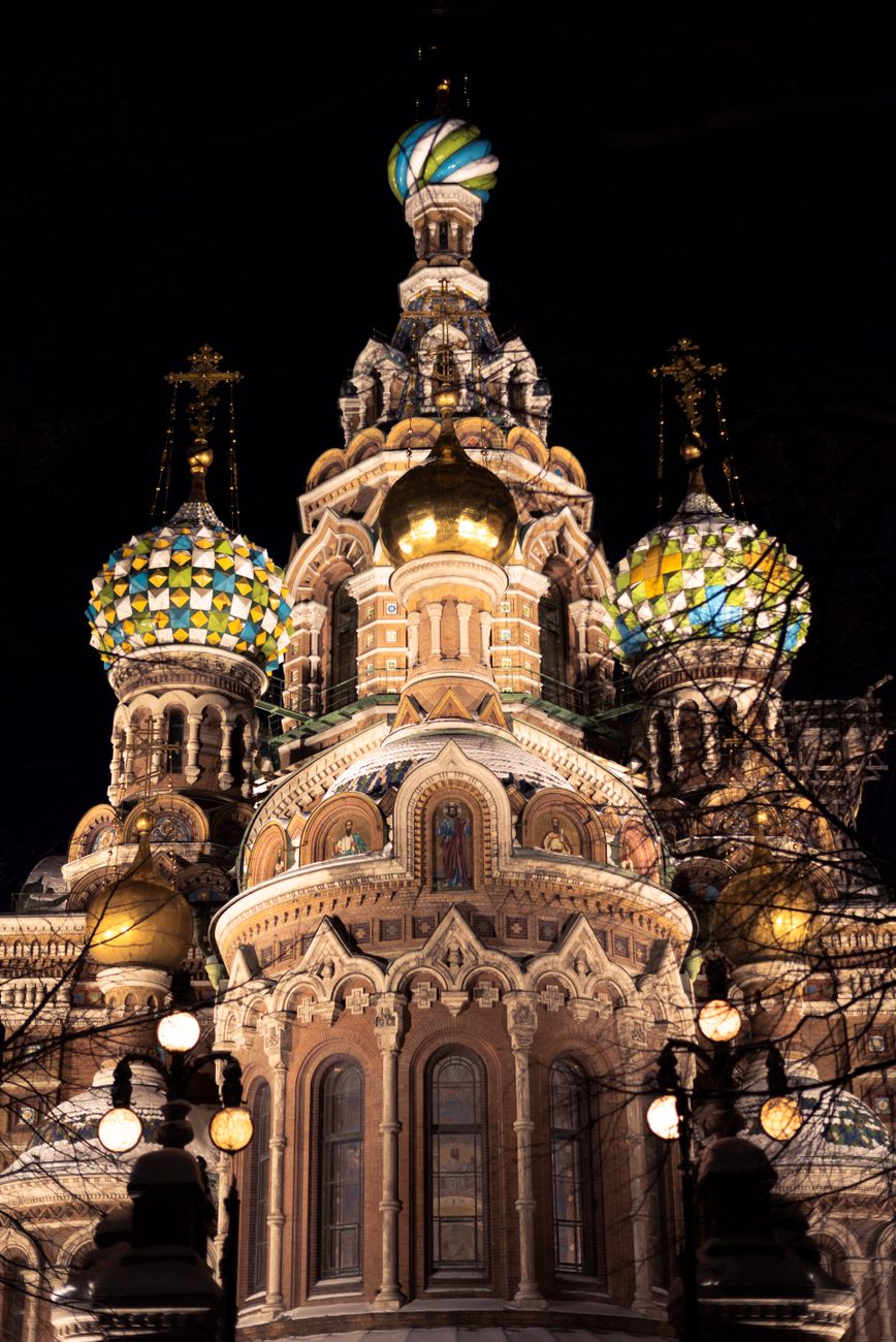 Intricate enamel onion domes and mosaic facade of the Church of the Savior on Spilled Blood in Saint Petersburg