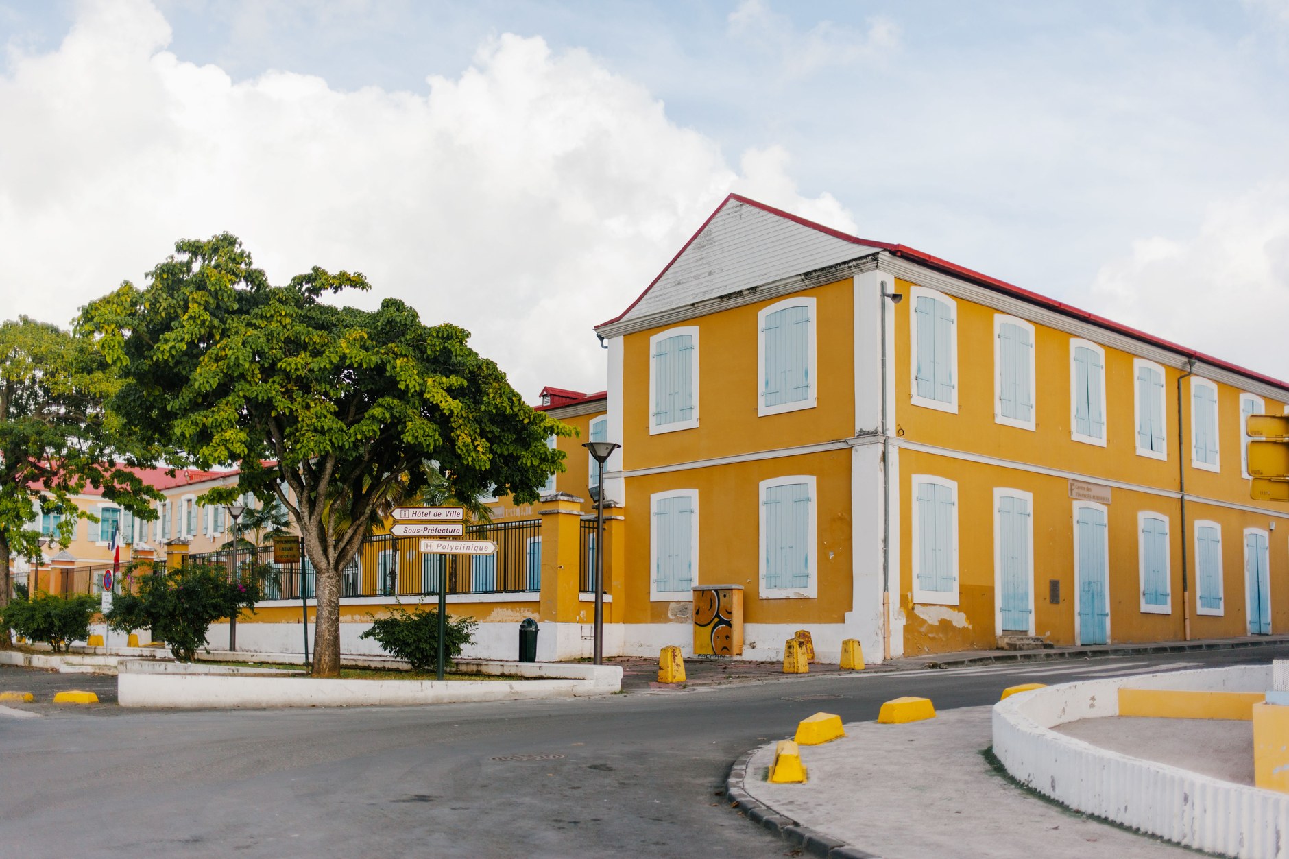 Traditional Caribbean Georgian building with bright shutters and shaded verandah in Basseterre