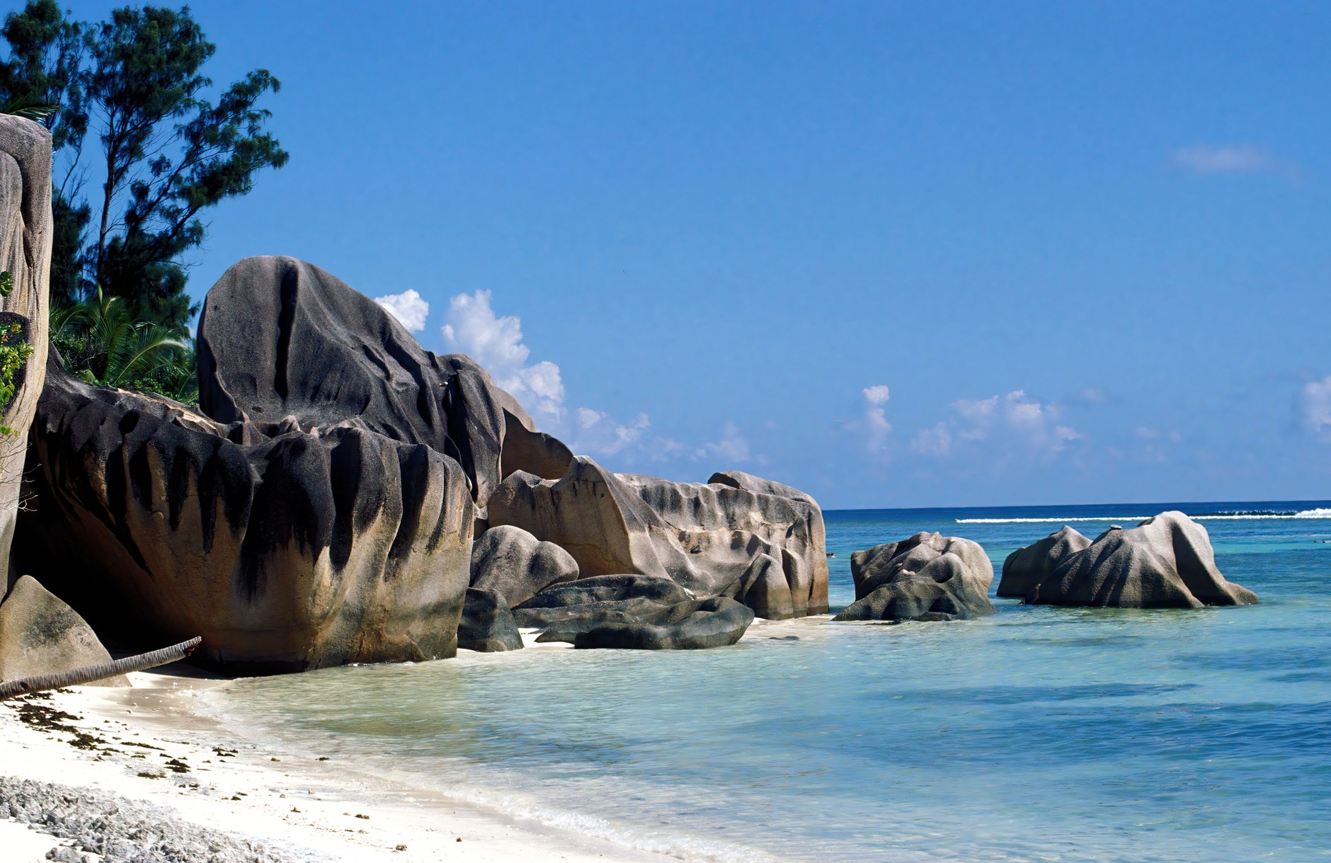 Anse Source d'Argent on La Digue with colossal pink-hued granite boulders framing shallow coral waters
