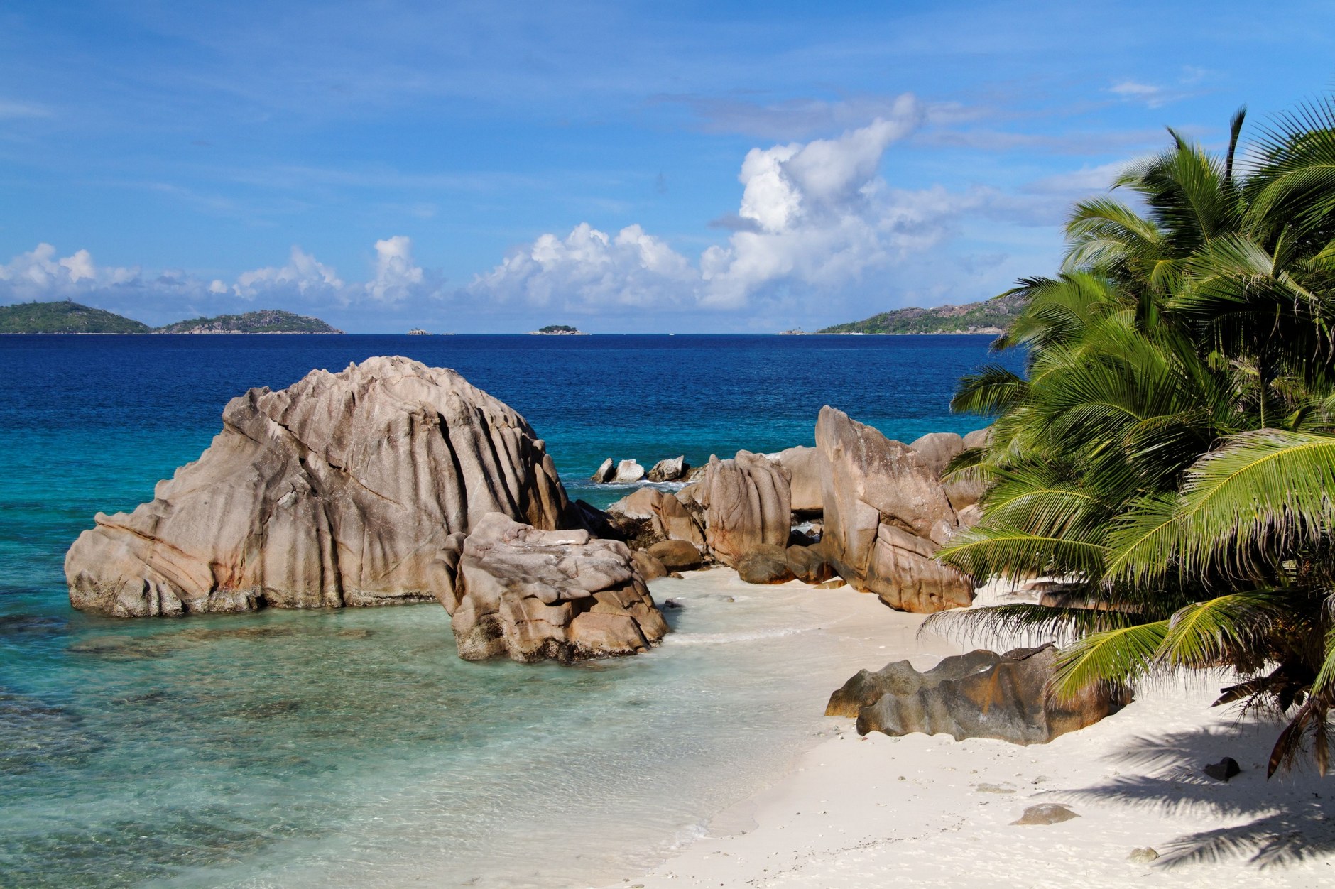 Smooth prehistoric granite rocks sculptured by millennia of sea tides along the Seychelles shore