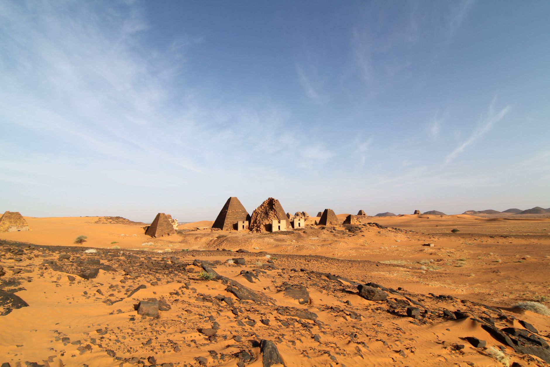 Historic royal pyramids of the Kingdom of Kush standing in the arid desert sands of Meroë
