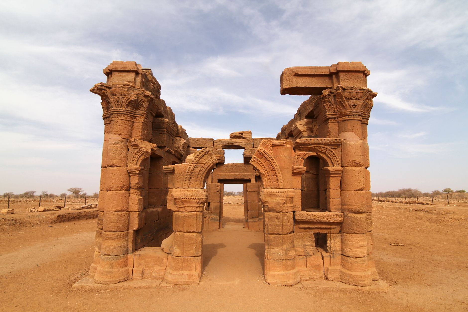 Carved sandstone pylons and relief figures of the ancient Roman-Kushite temple complex at Naqa