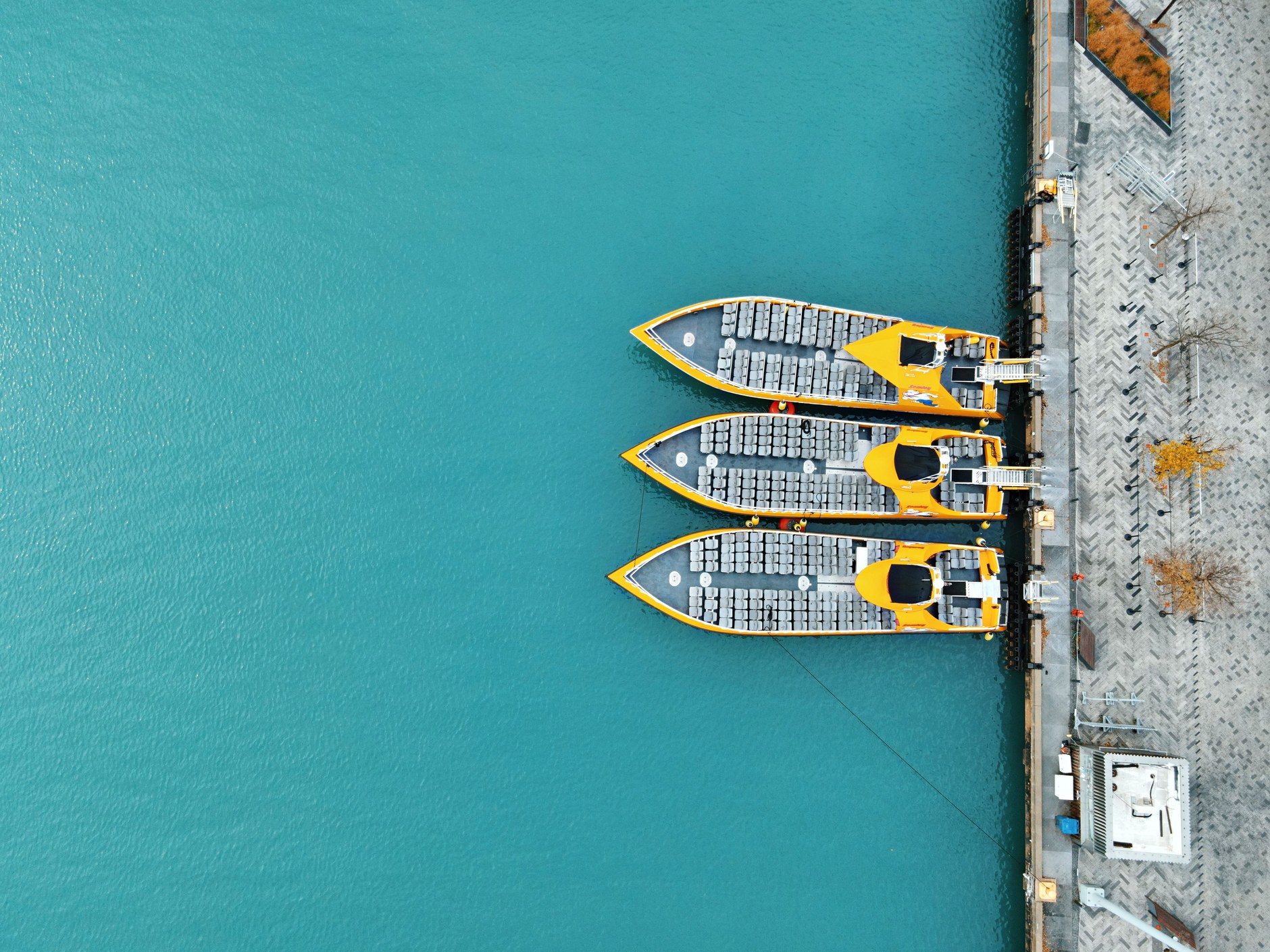Passenger ferry departing a sheltered turquoise marina canal connecting Providenciales and North Caicos