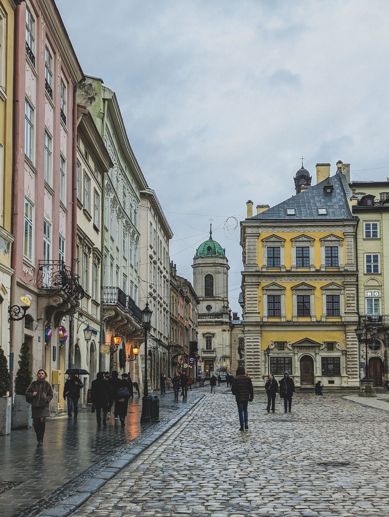 Cobblestone street in Lviv's historic old town lined by classic 19th-century Austro-Hungarian facades