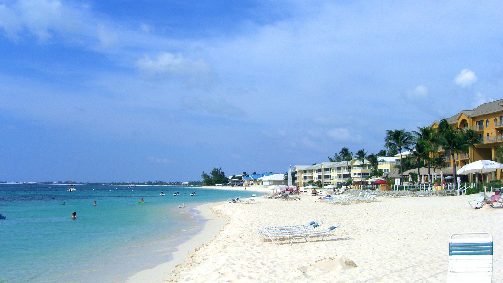 Scenic travel view of Seven Mile Beach and coastal resorts in Grand Cayman