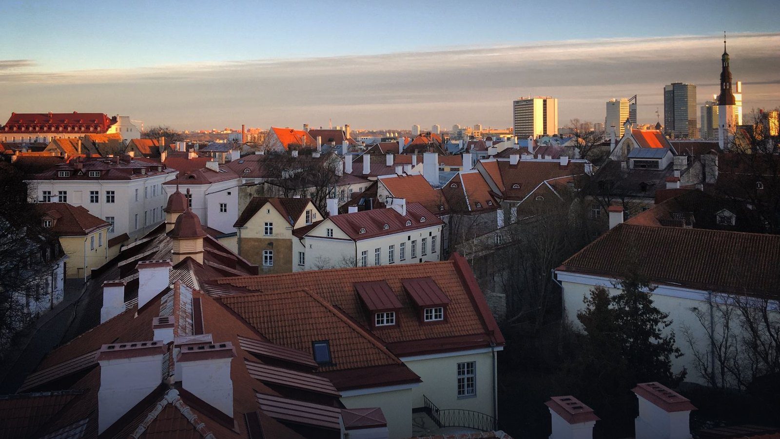 Overhead panoramic view from Toompea Hill across the red tile roofs and medieval church spires of Tallinn Old Town