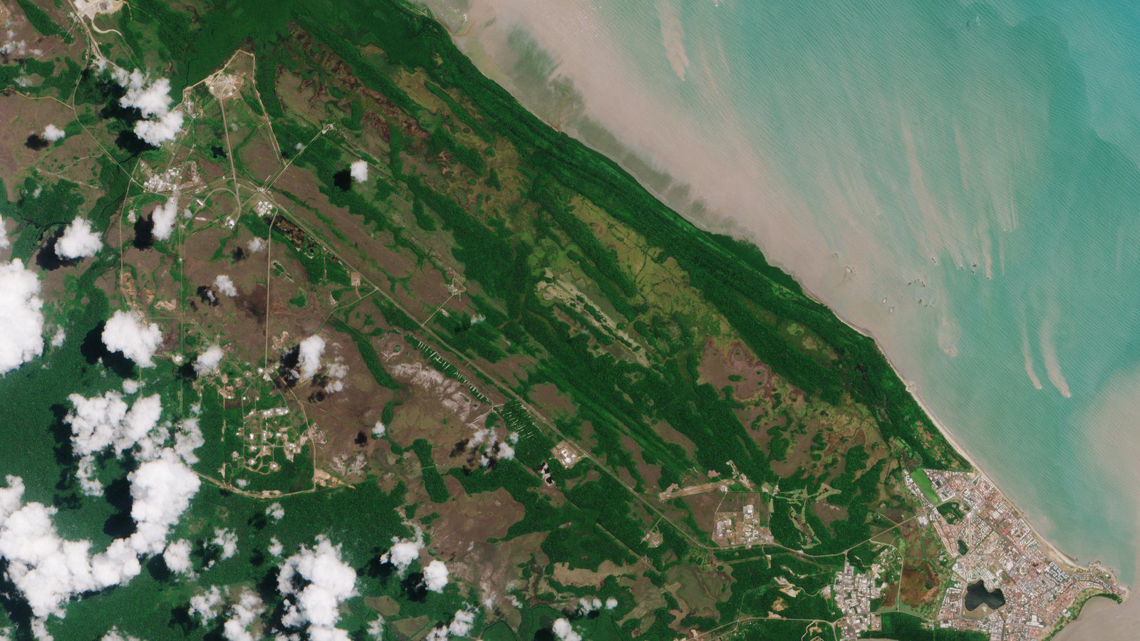 Scenic travel view of coastal riverfront and space centre area in Kourou, French Guiana