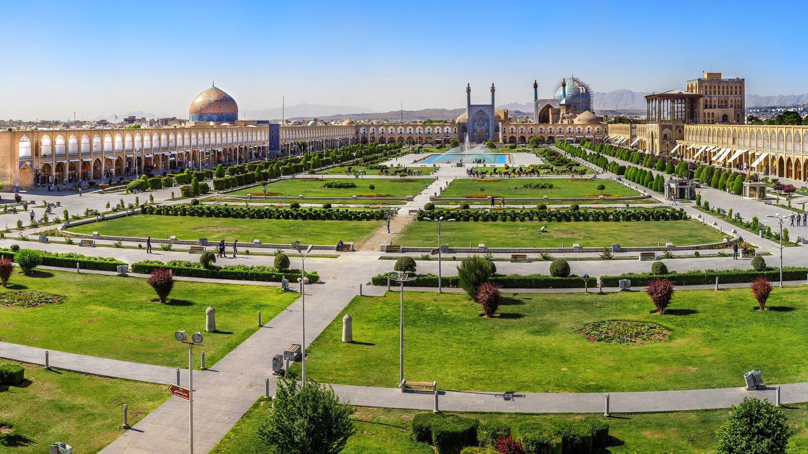 Grand historic architectural view of Naghsh-e Jahan Square with illuminated fountains and dome of Shah Mosque in Isfahan, Iran
