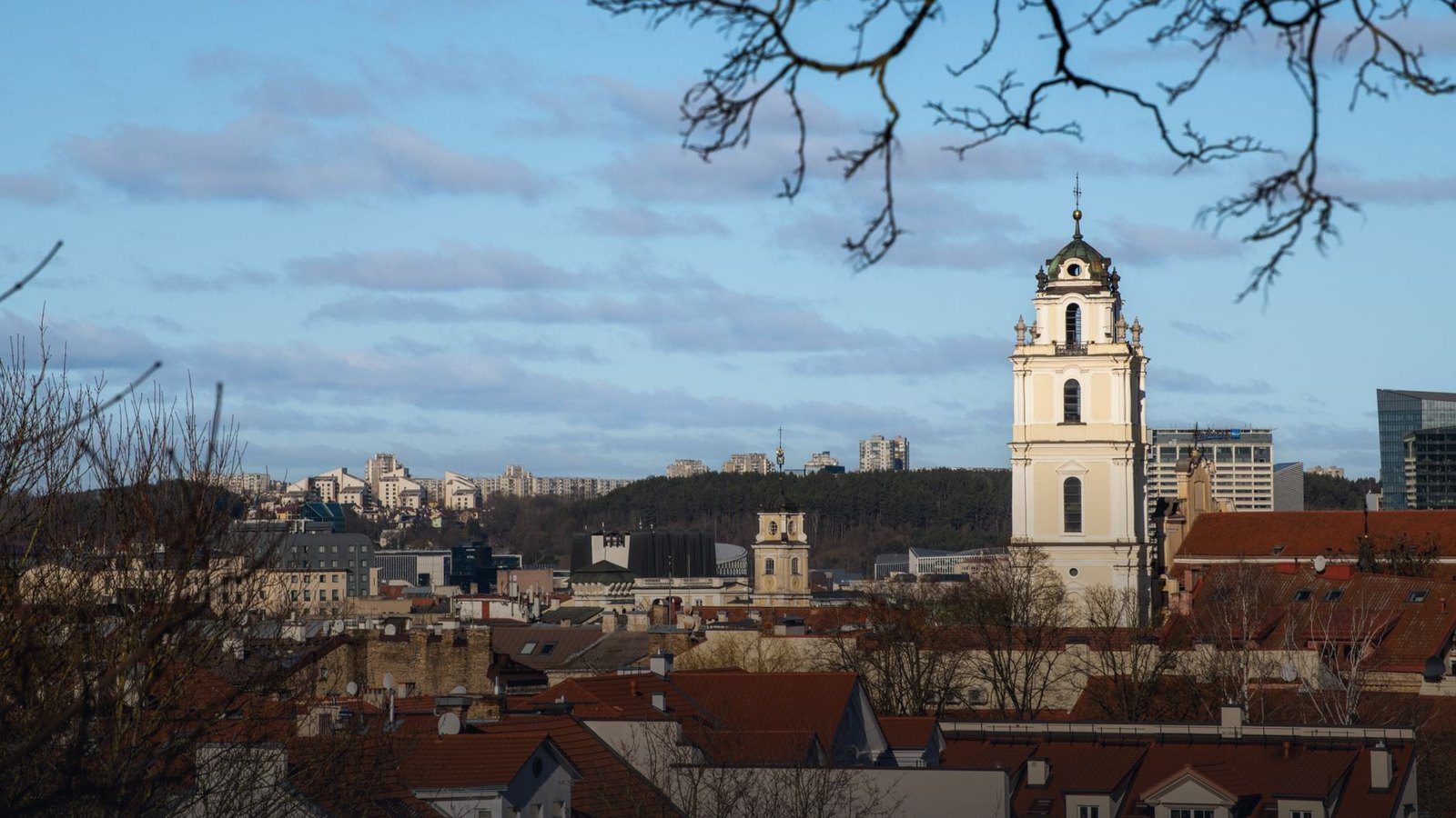 Red brick octagonal Gediminas Tower standing atop Castle Hill overlooking the Old Town of Vilnius