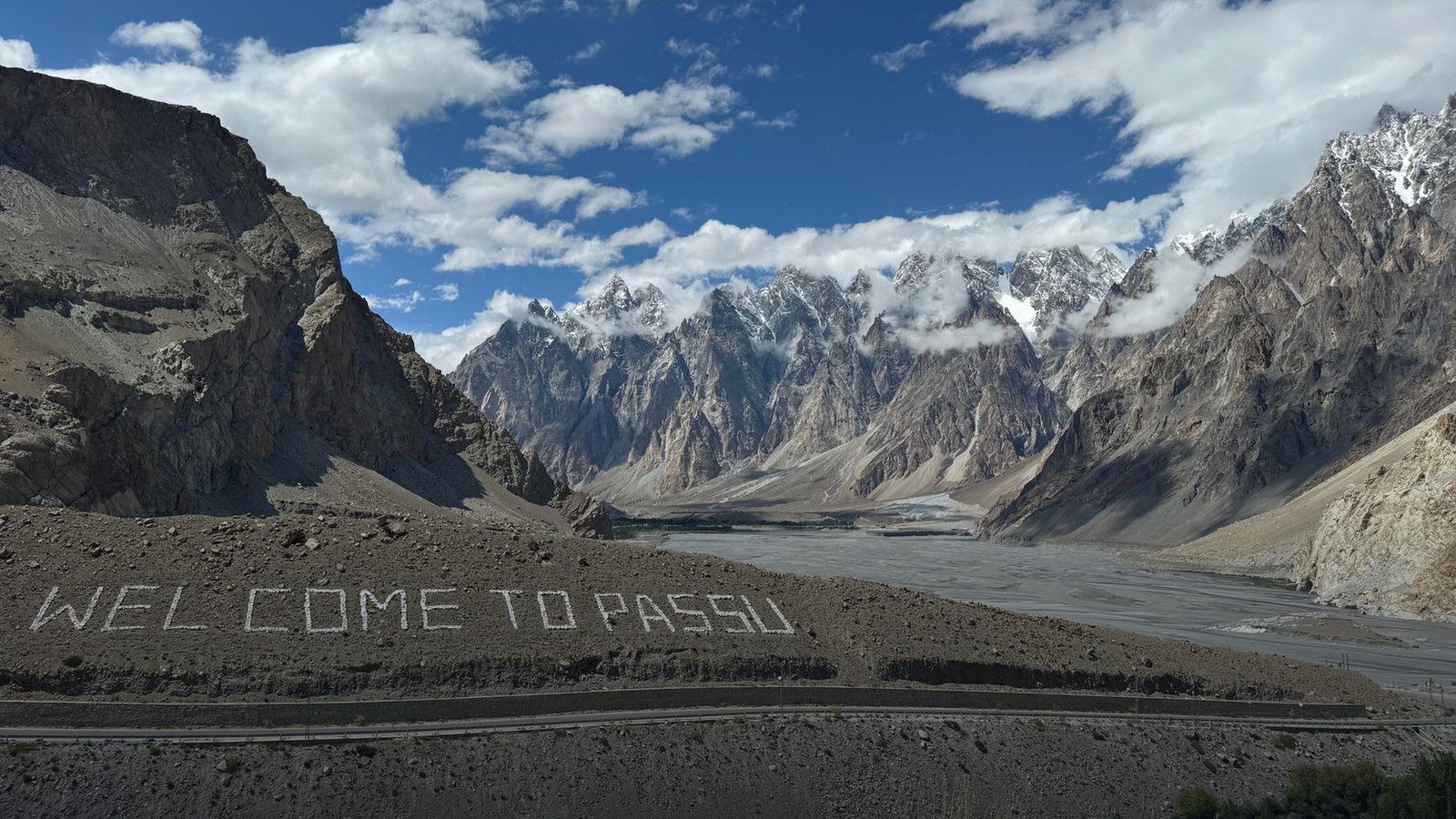 Serrated cathedral-like granite mountain peaks of the Passu Cones rising above the Karakoram Highway in northern Pakistan